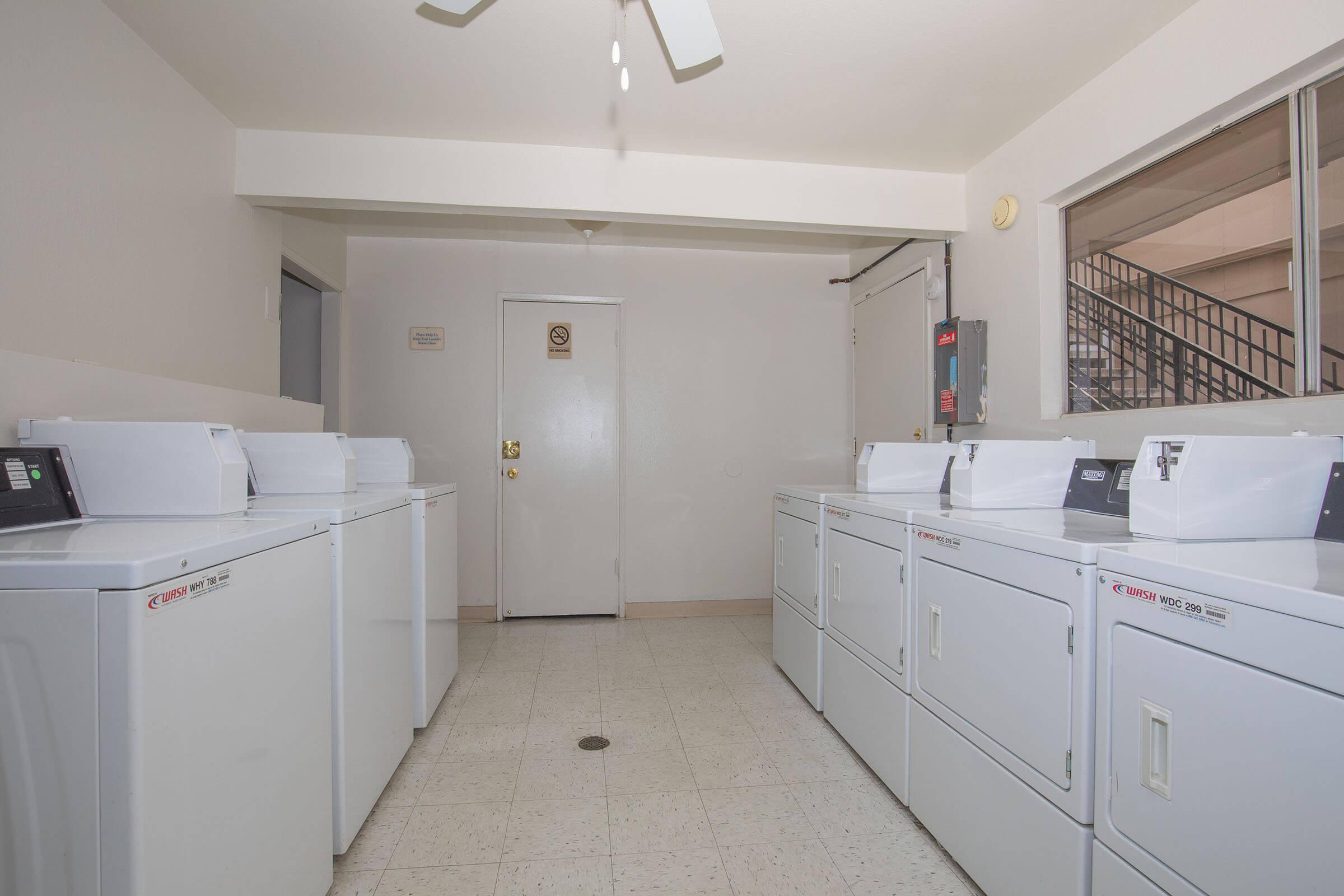 a kitchen with a sink and a refrigerator