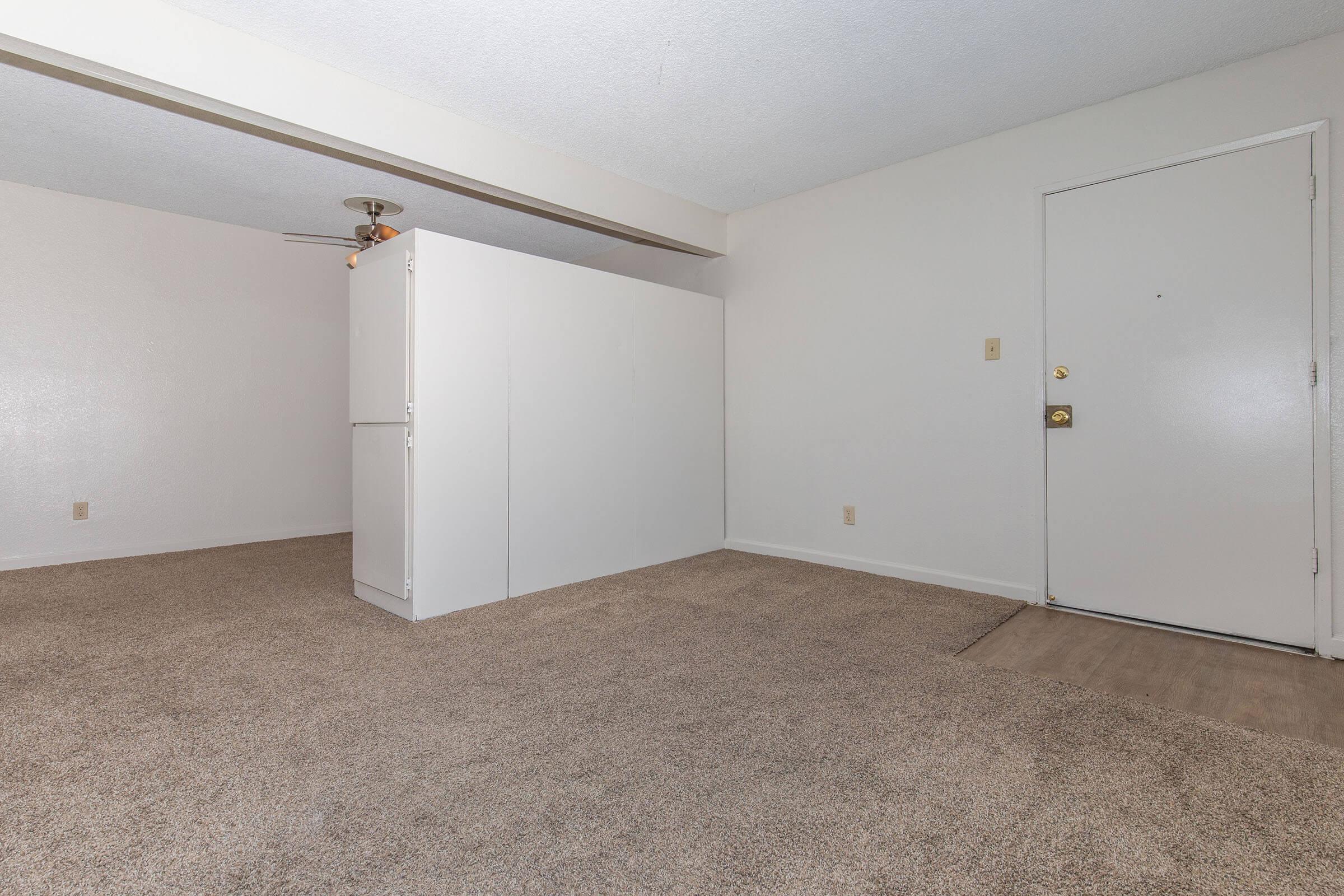 a refrigerator in a small room