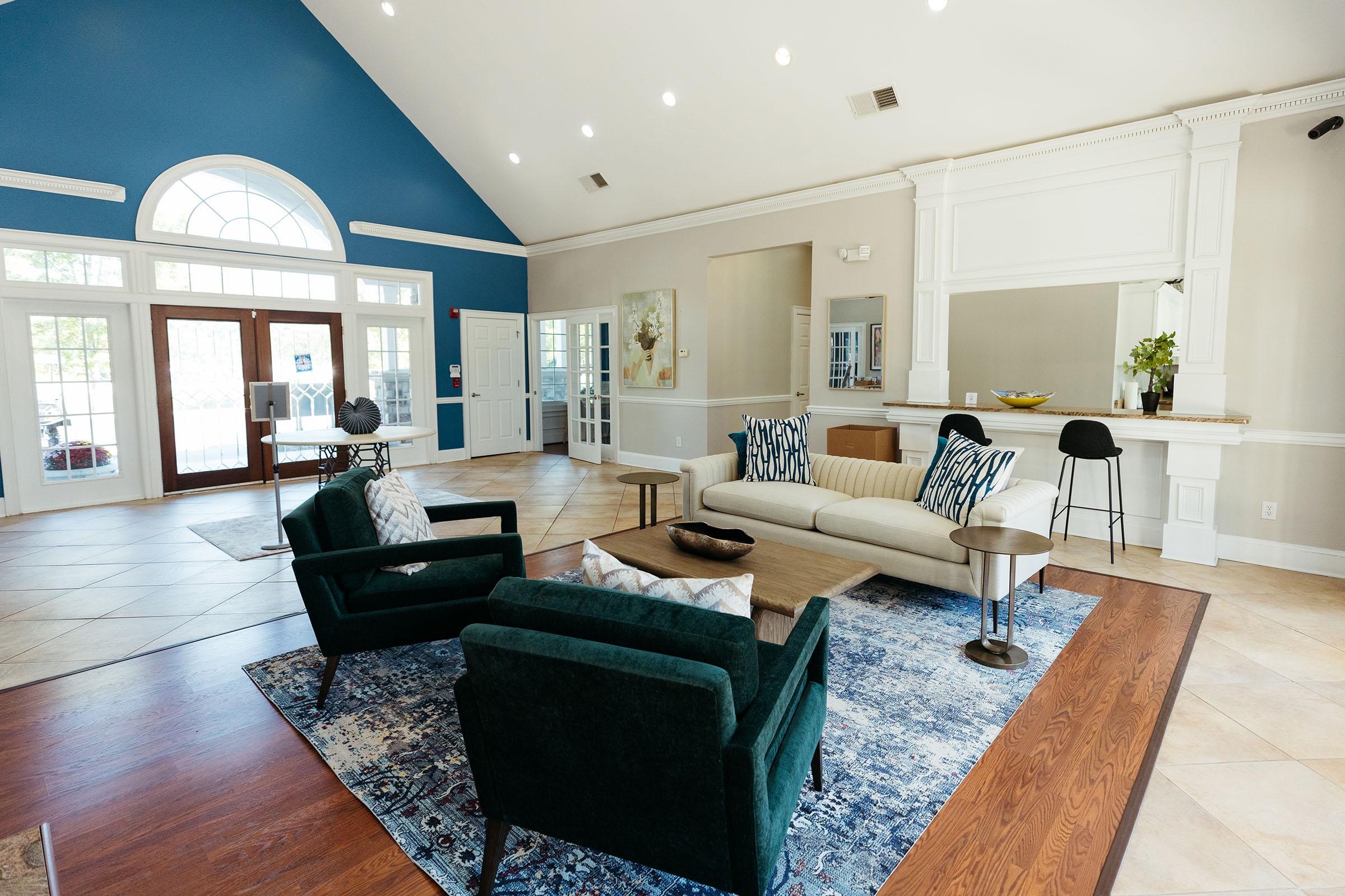 a living room filled with furniture and a large window