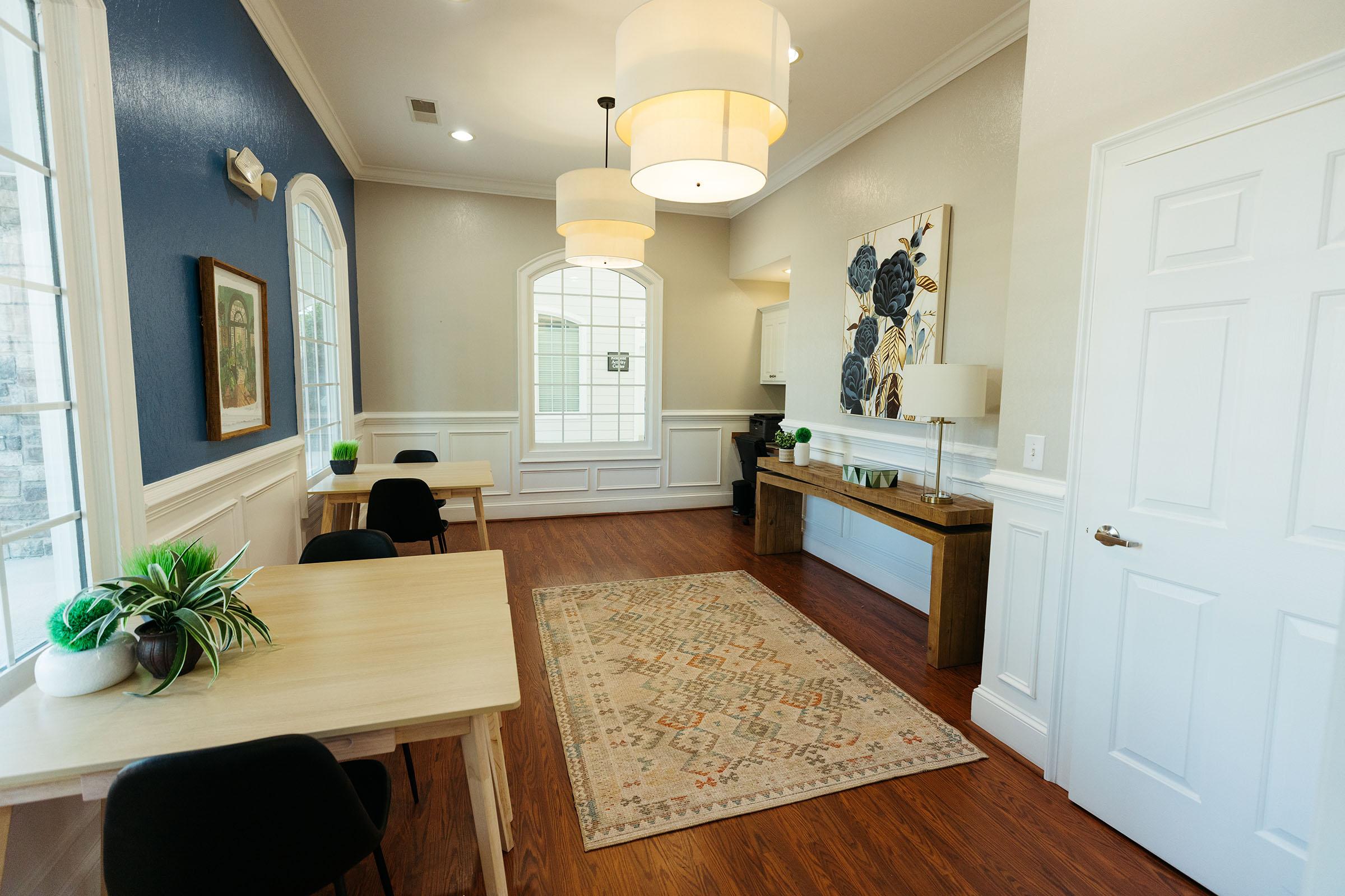 a living room with a sink and a window