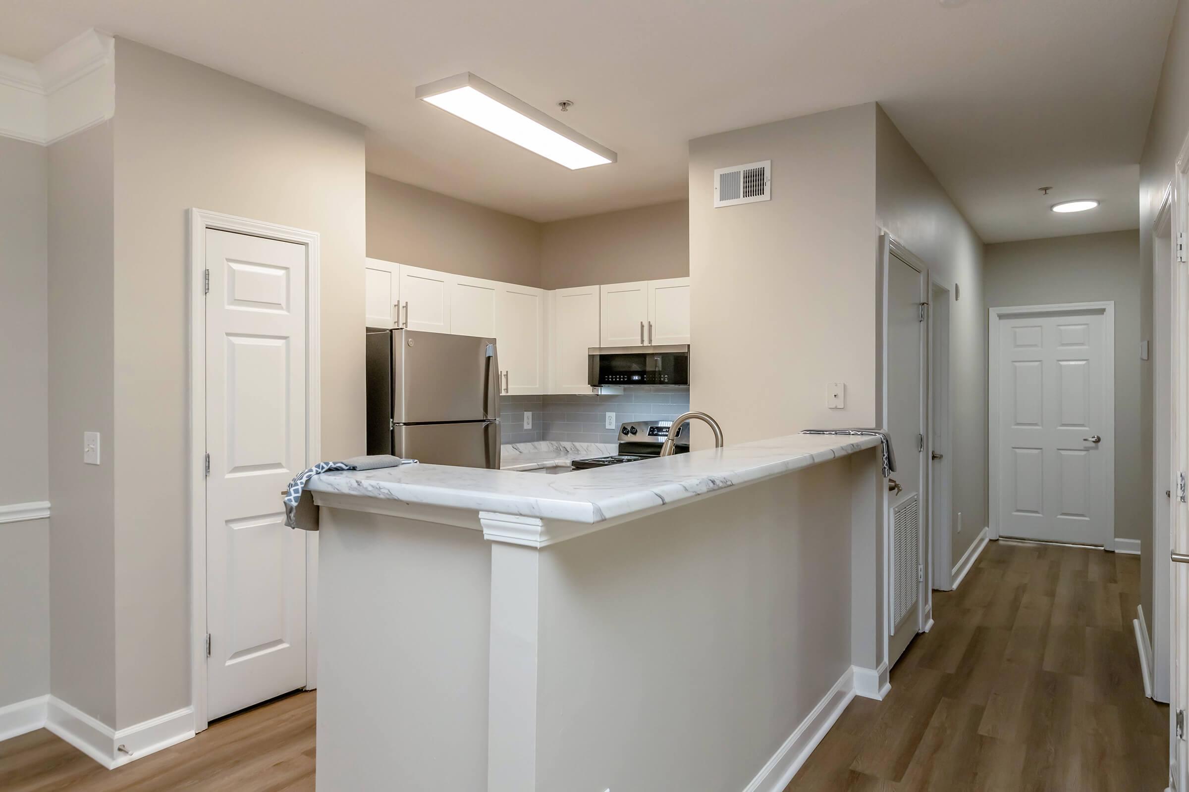 a kitchen with a sink and a refrigerator