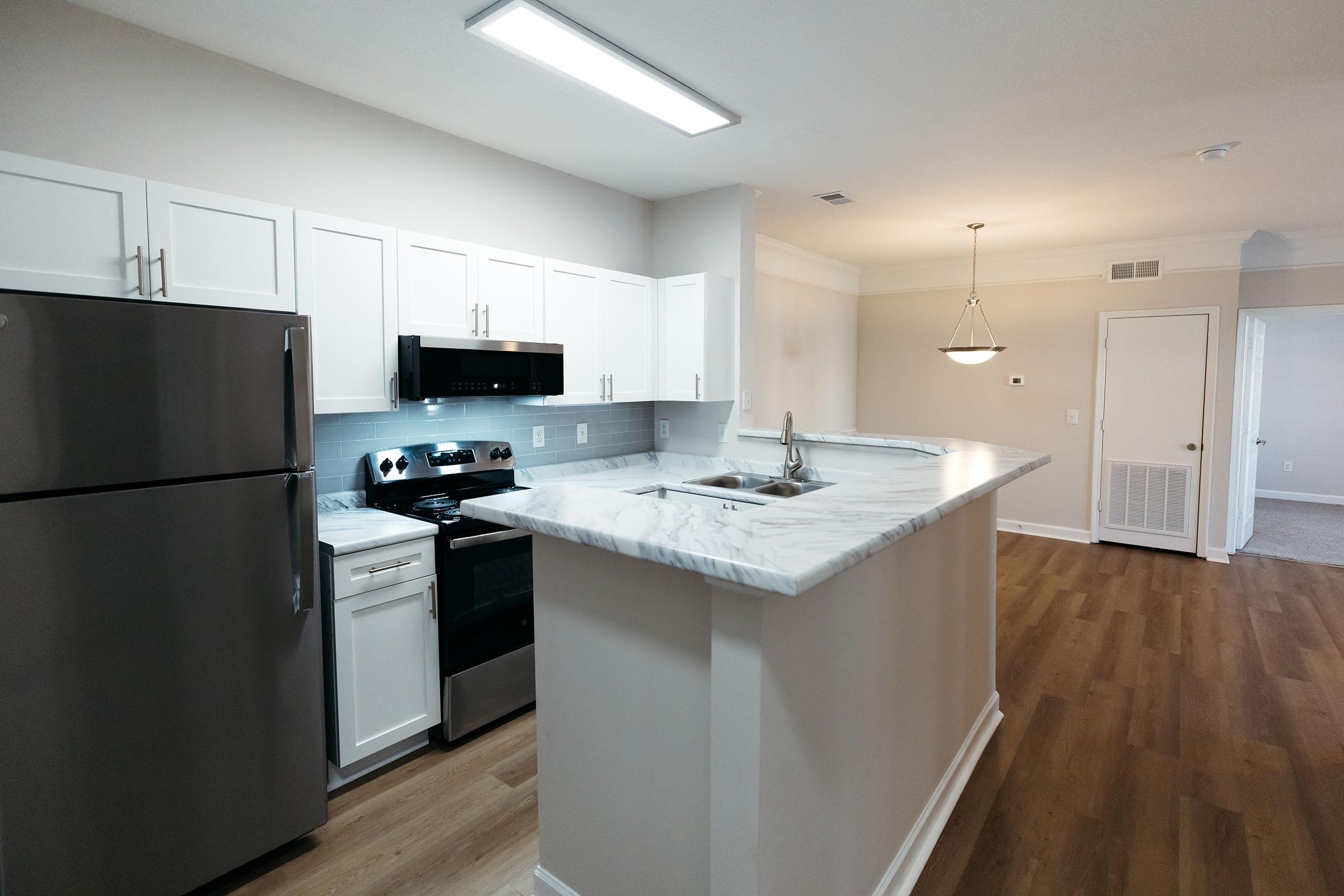 a kitchen with a tile floor