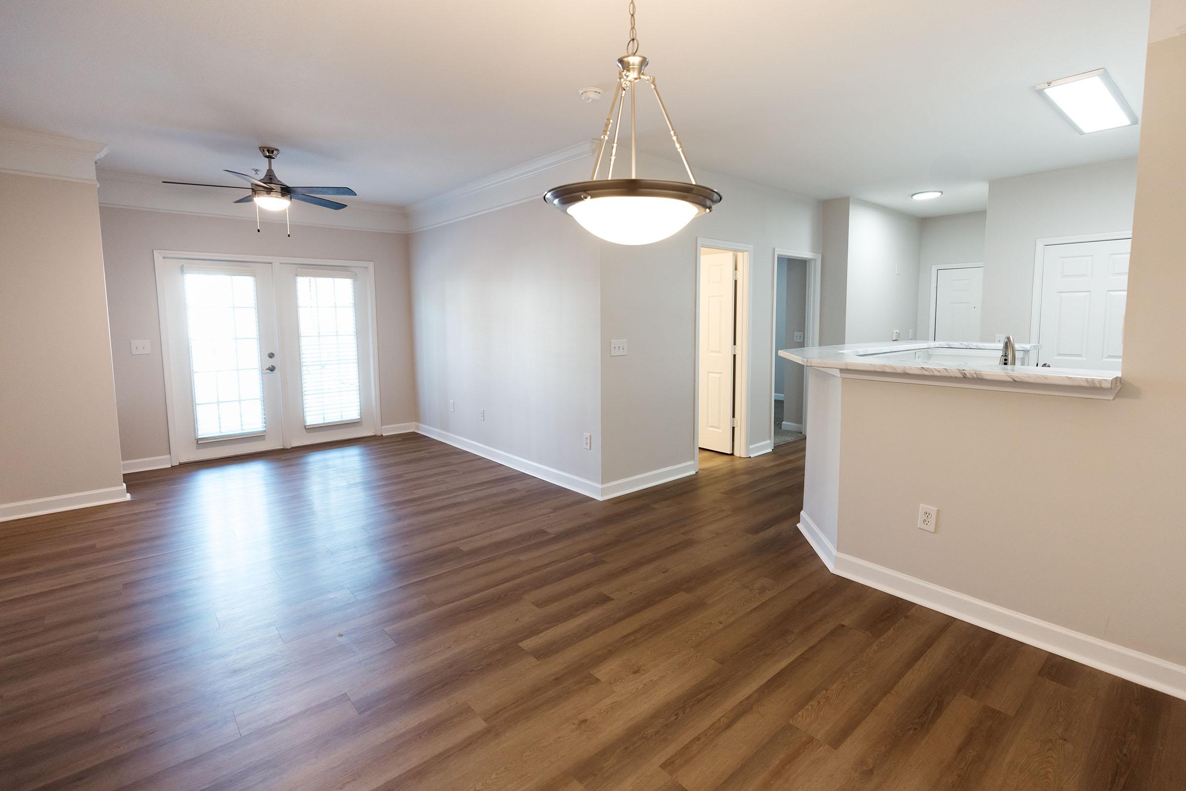 a large empty room with a wood floor