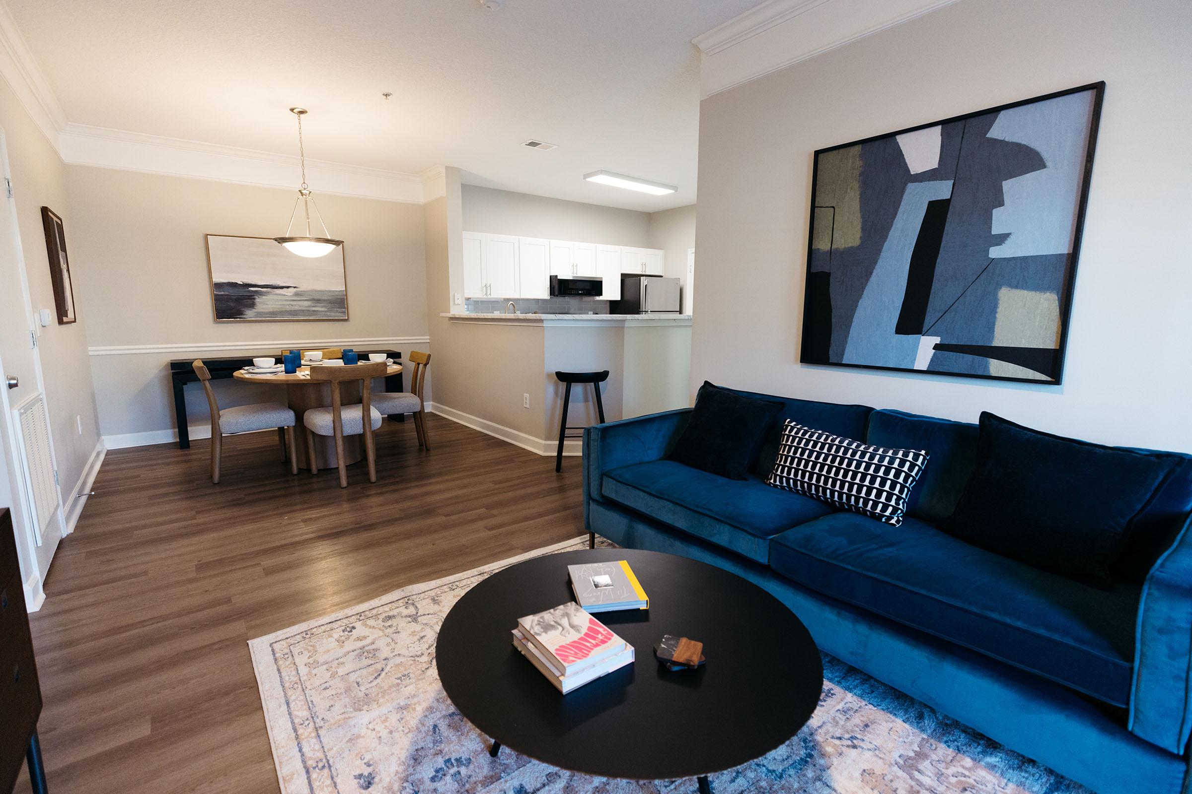 a living room filled with furniture and a table