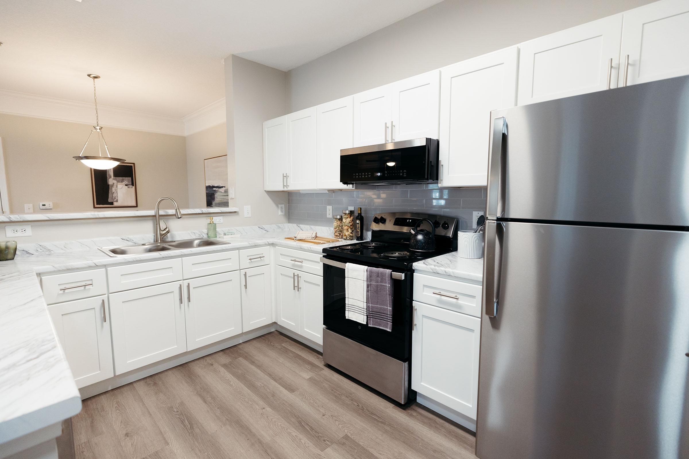 a stainless steel refrigerator in a kitchen