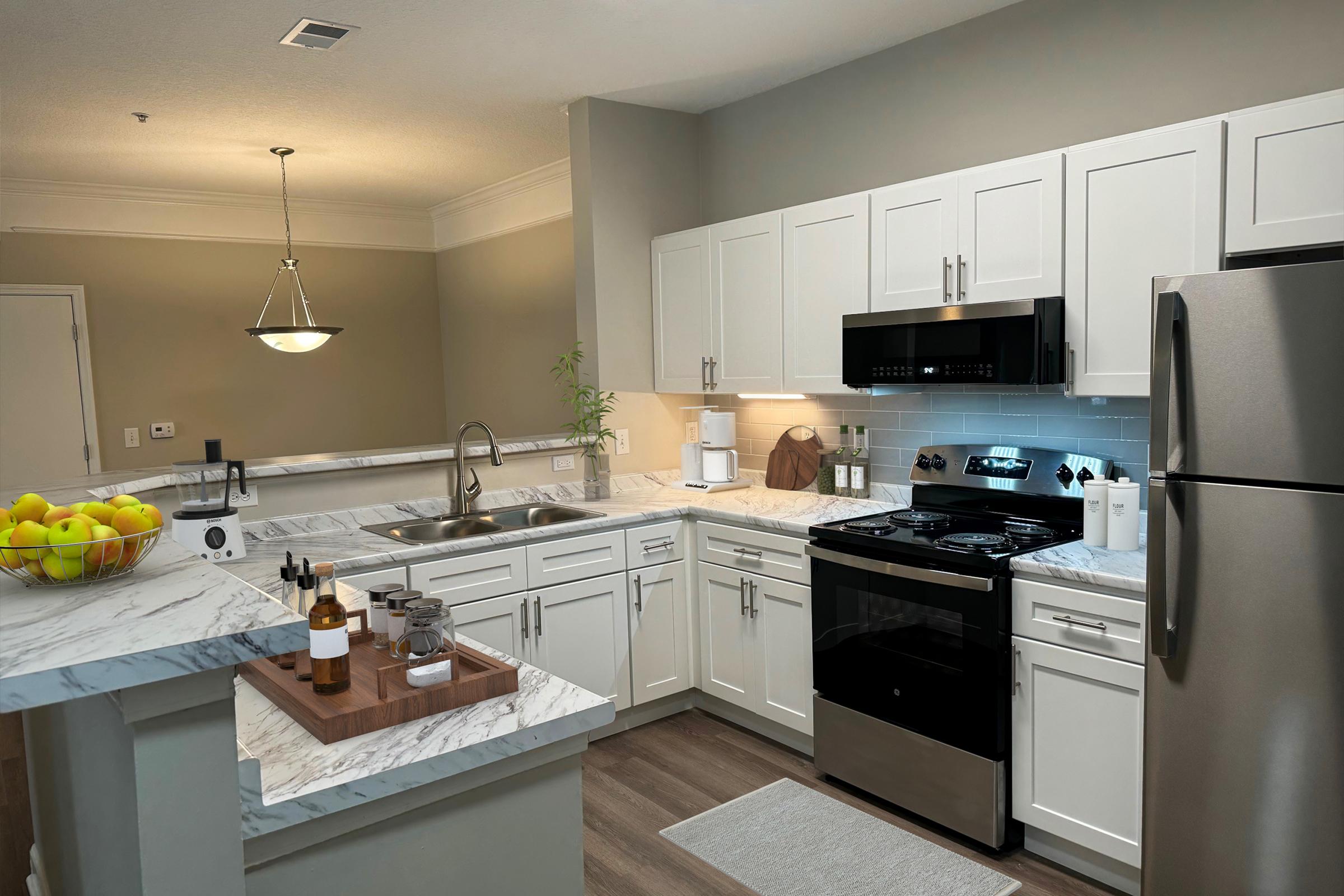 a kitchen with a sink and a refrigerator