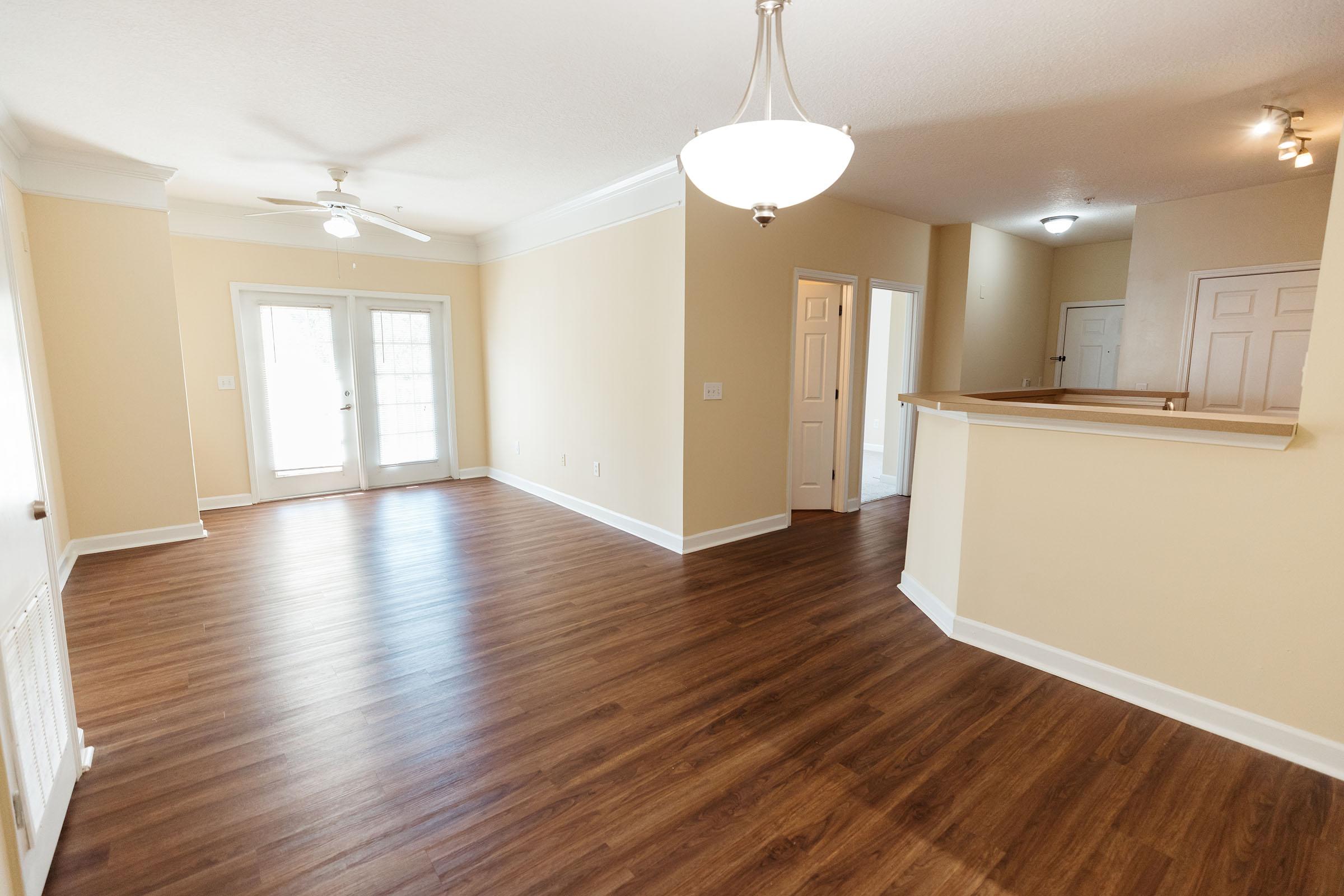 a large empty room with a hard wood floor