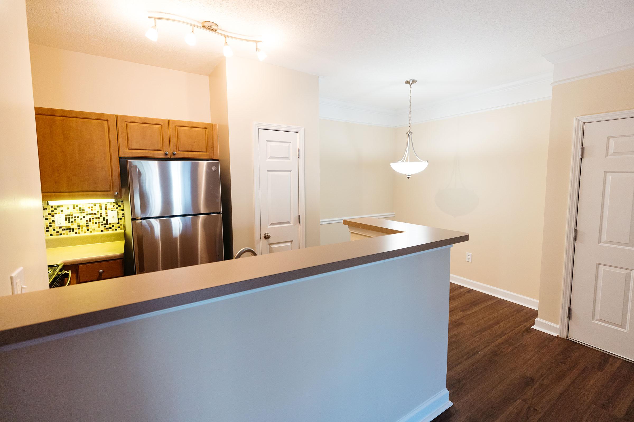 a stainless steel refrigerator in a kitchen