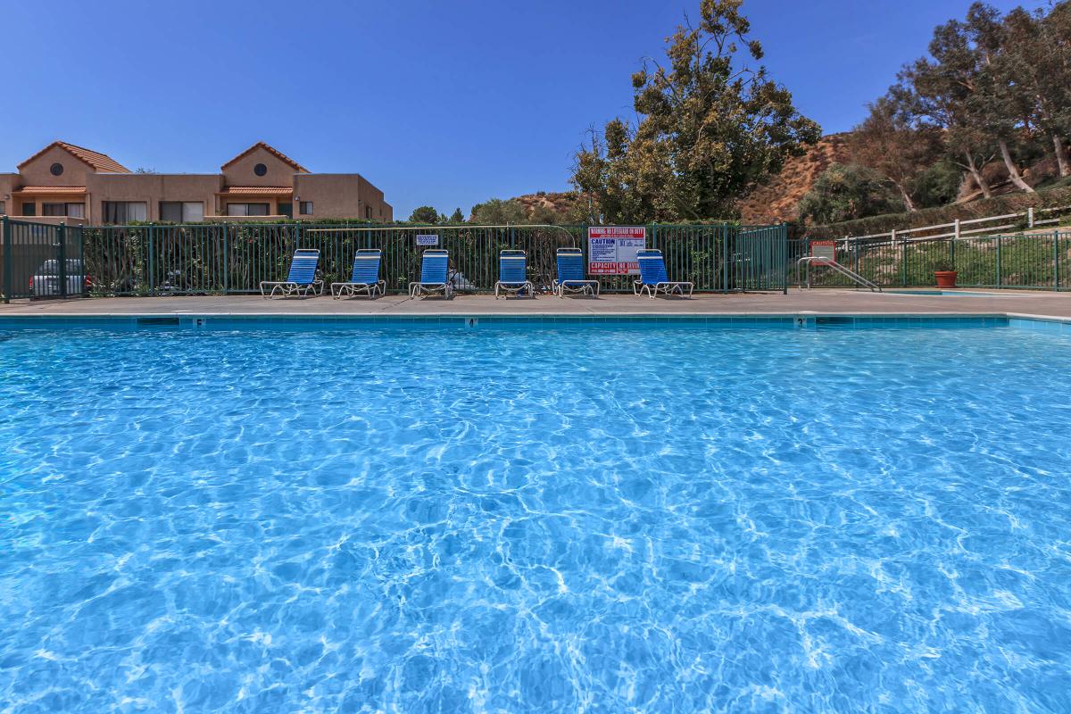 a pool next to a body of water