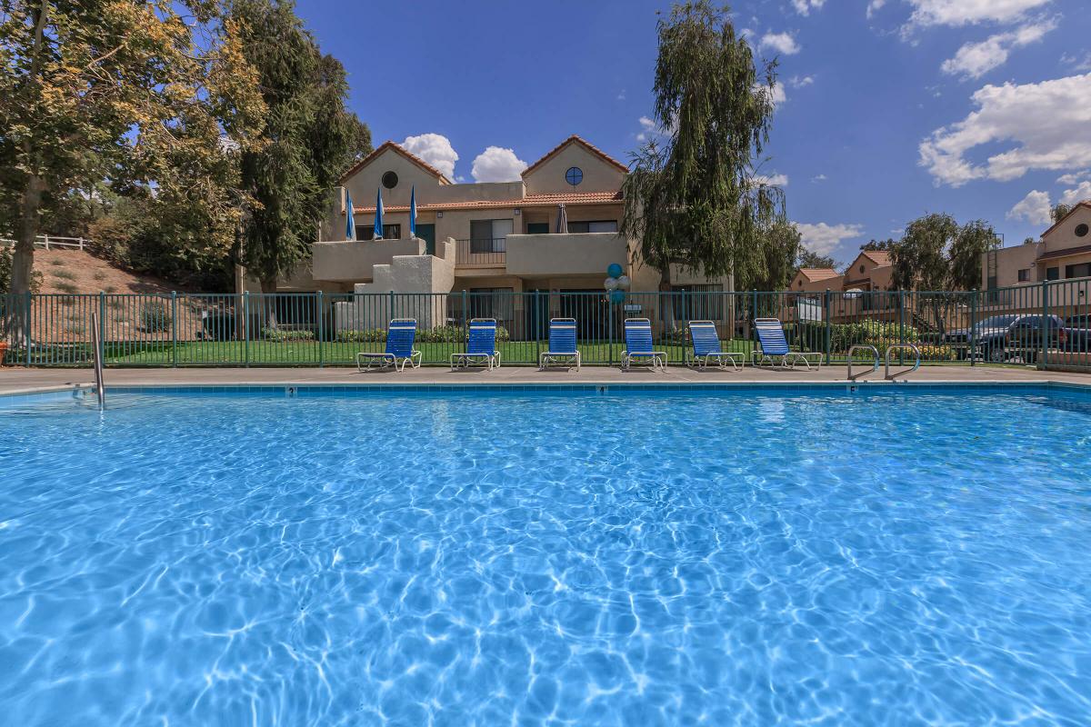 a pool next to a body of water