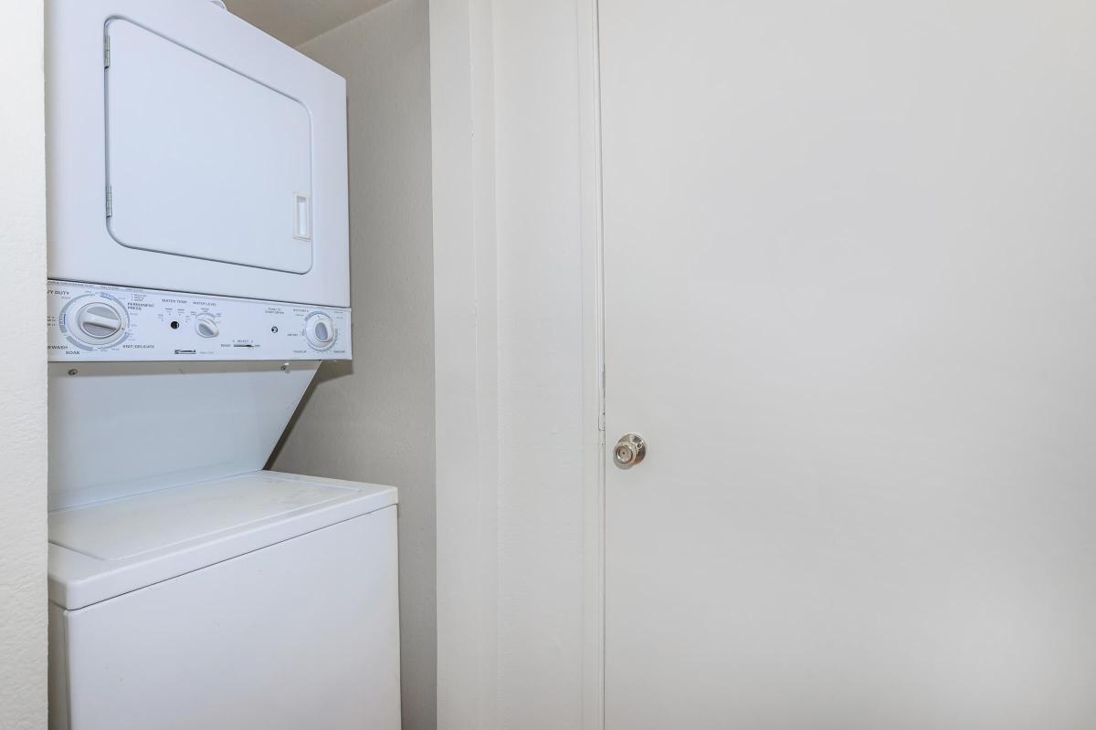 a white refrigerator freezer sitting next to a door