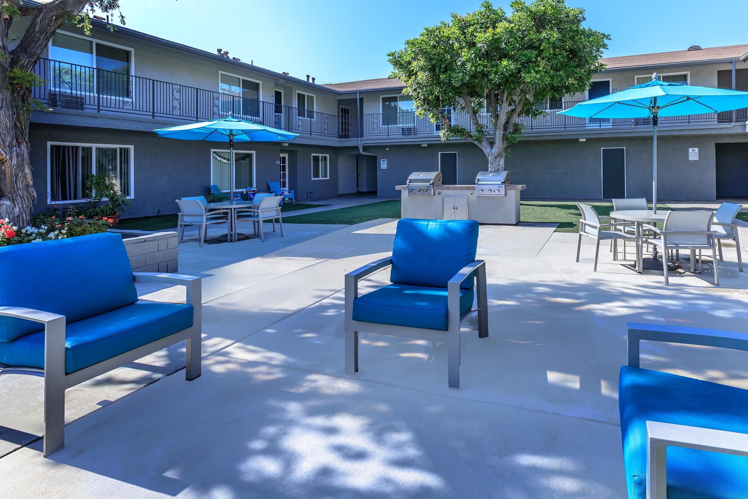 a blue bench in front of a building