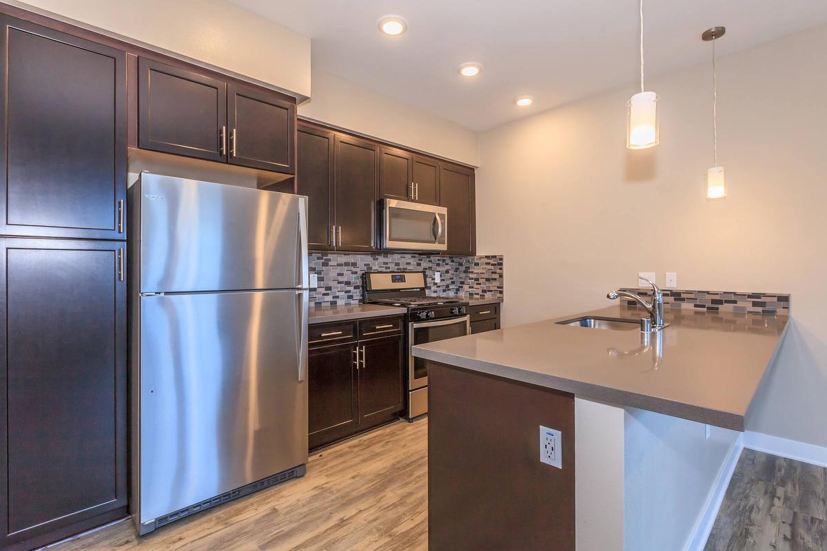 Vacant kitchen with stainless steel appliances