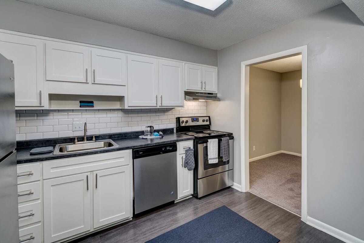 a large kitchen with stainless steel appliances