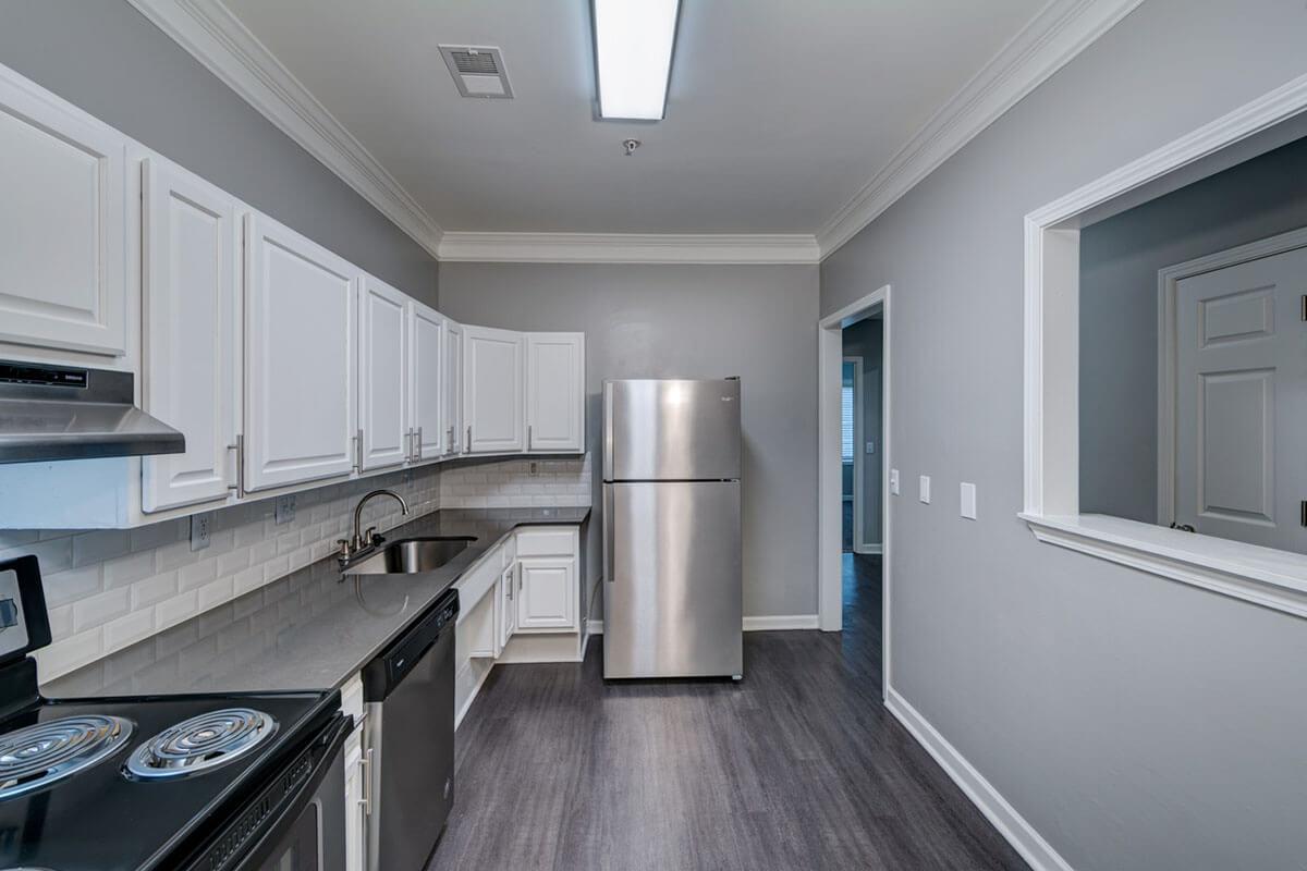 a large kitchen with stainless steel appliances