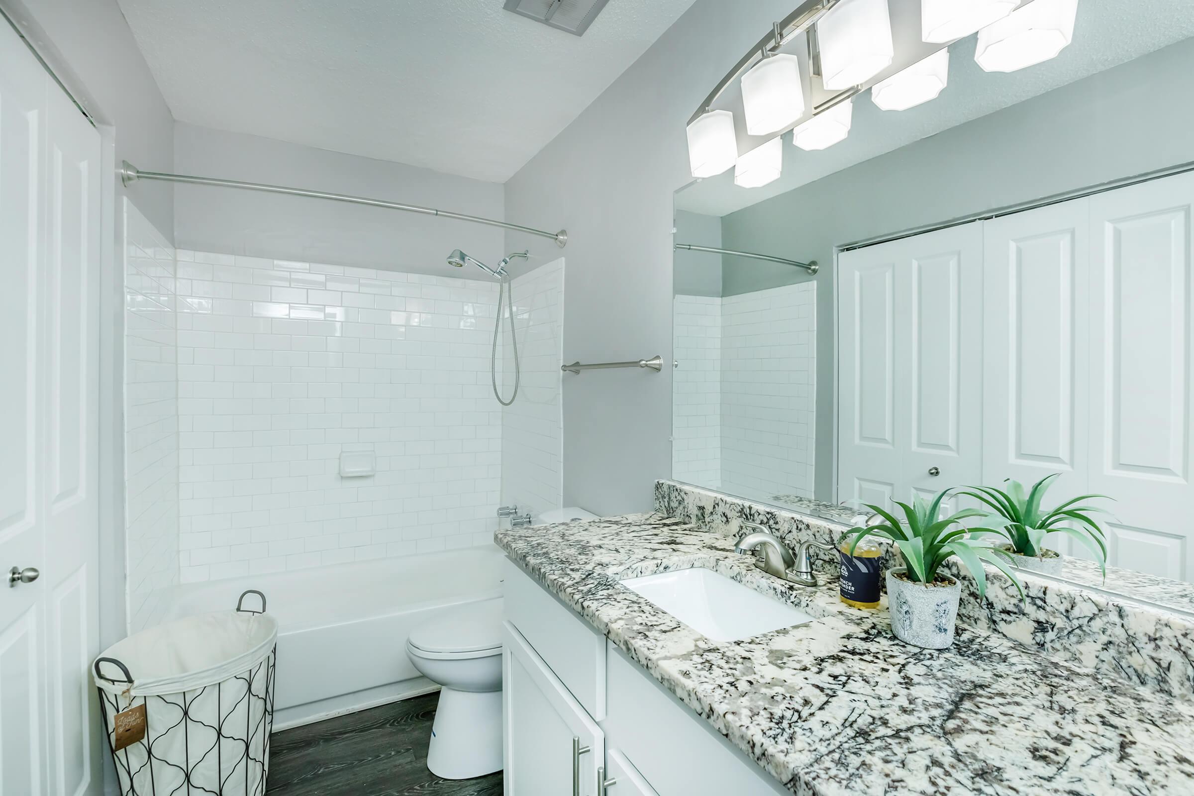 a kitchen with a sink and a mirror