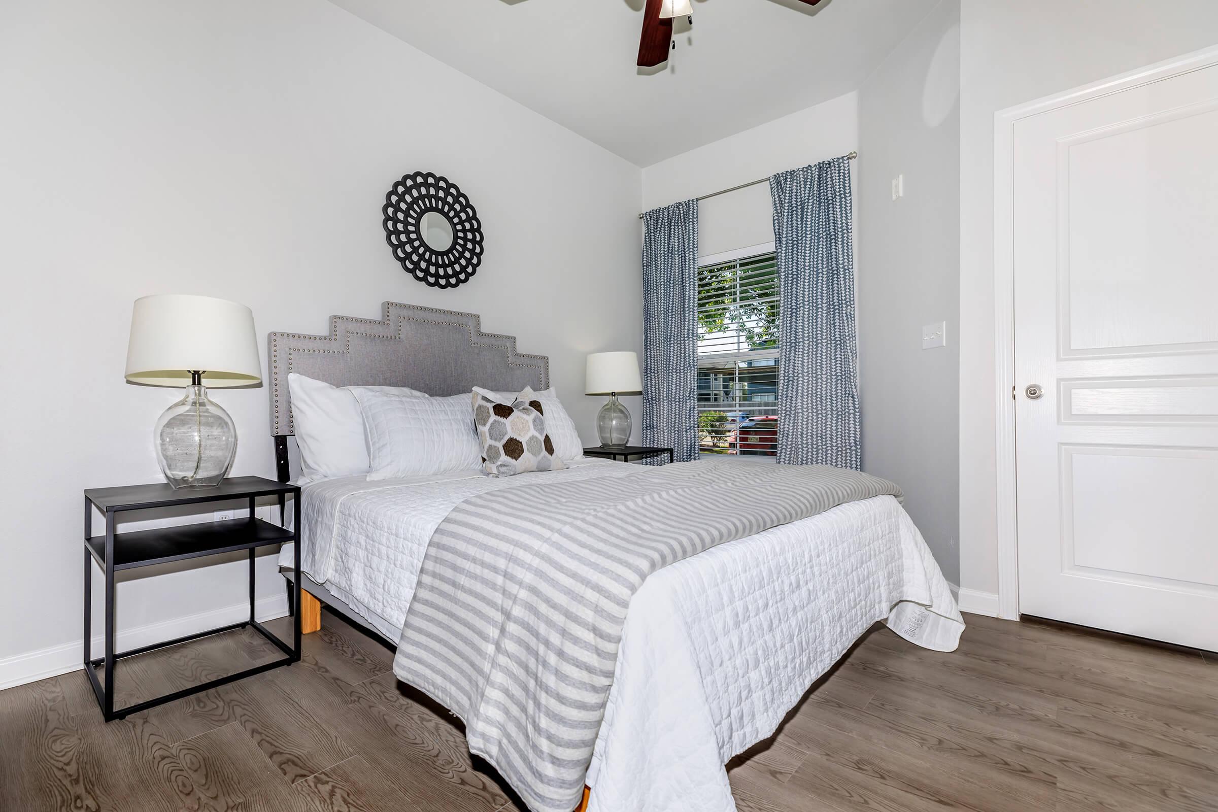 a bedroom with a bed in a room