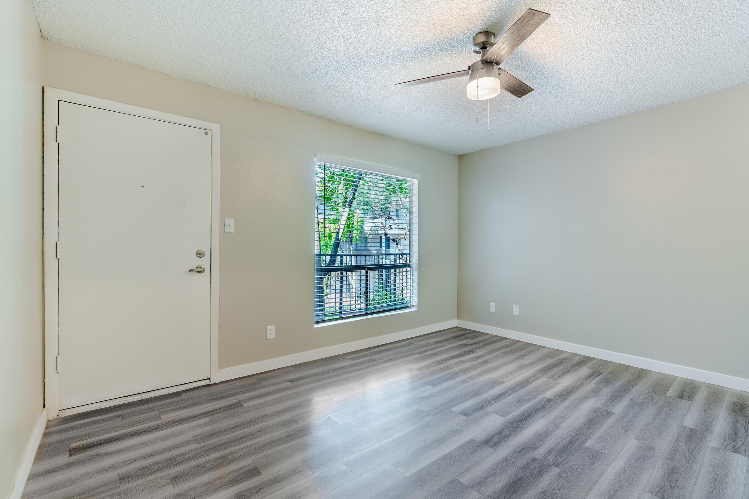 Open spacious living room and apartment entry way