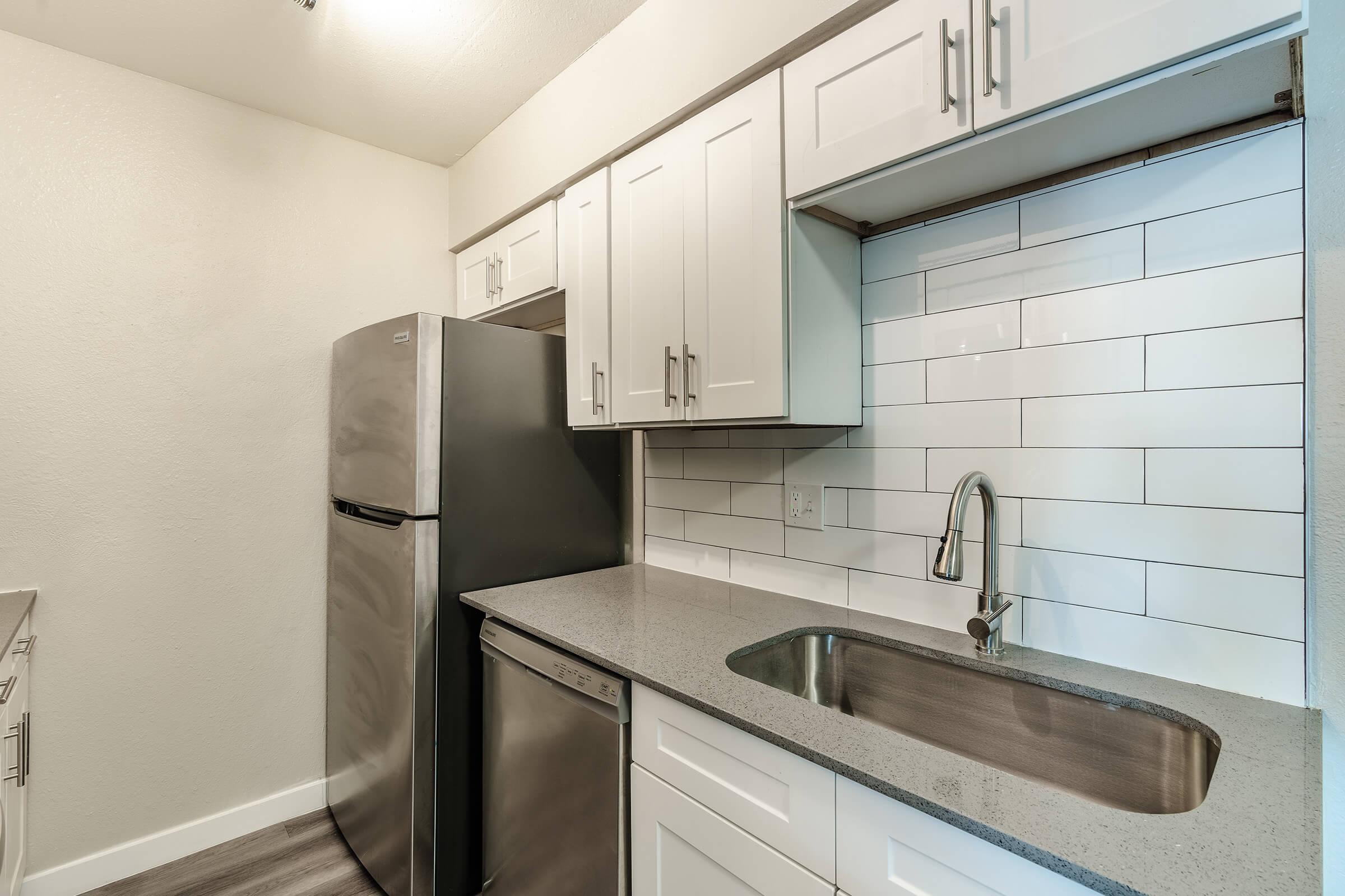 Close up of kitchen cabinets and stainless steel appliances