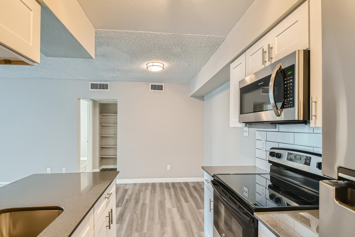 a kitchen with a stove and a sink