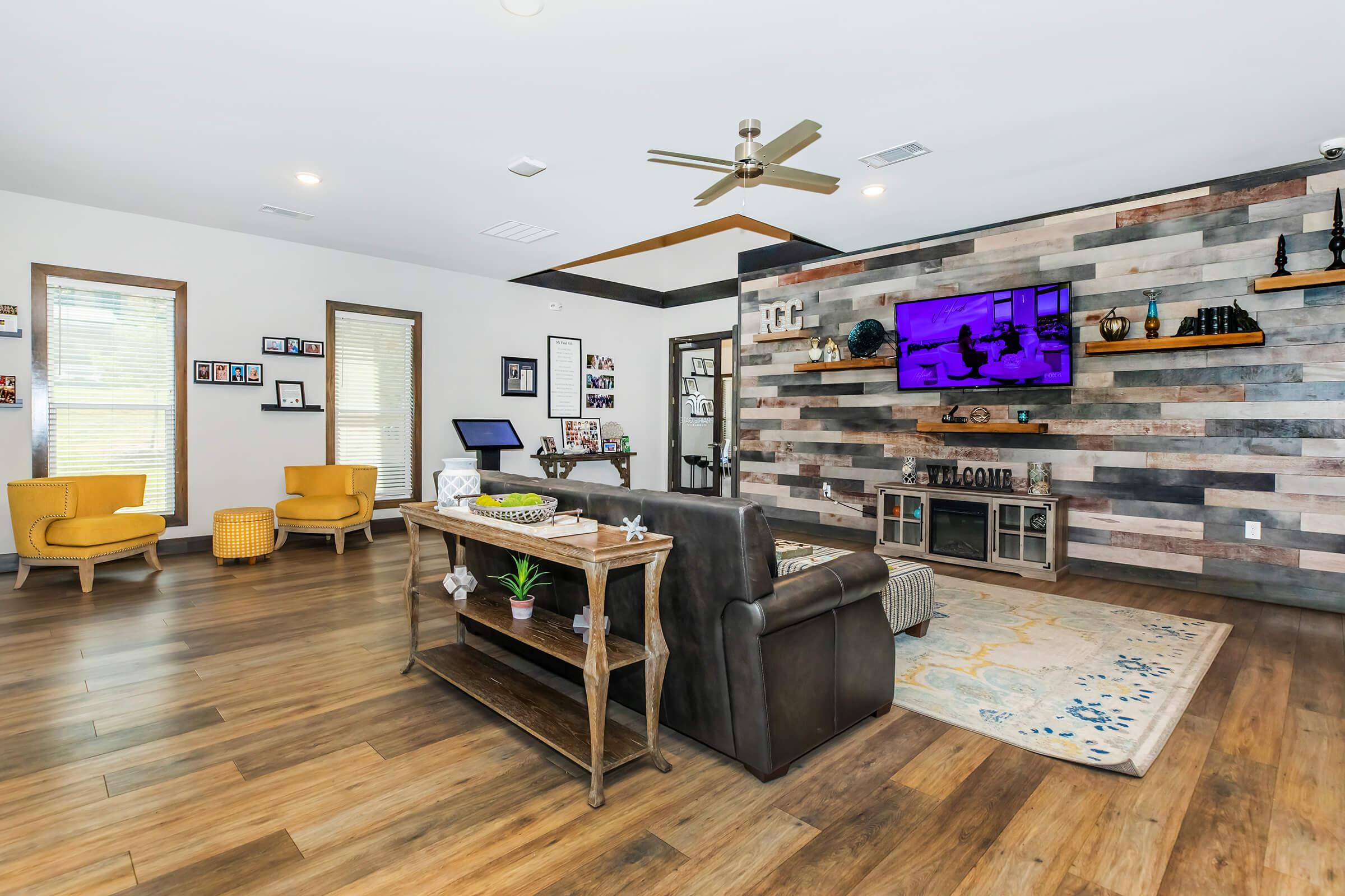 a room filled with furniture and a wood floor