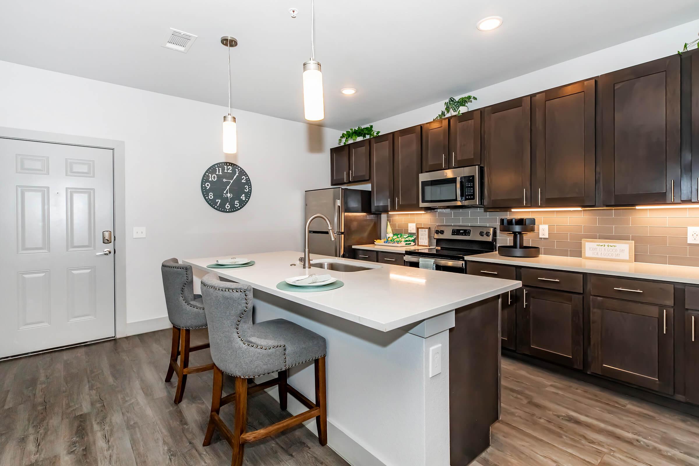 a modern kitchen with stainless steel appliances