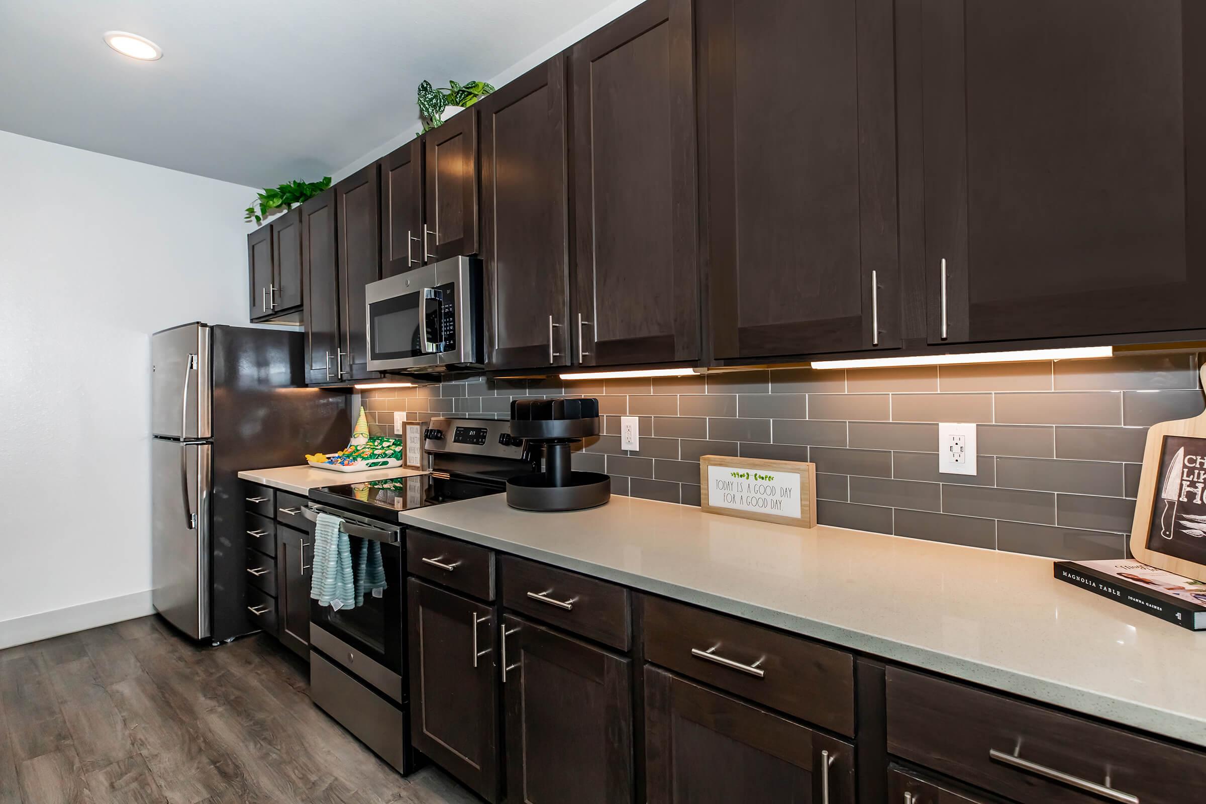 a modern kitchen with stainless steel appliances