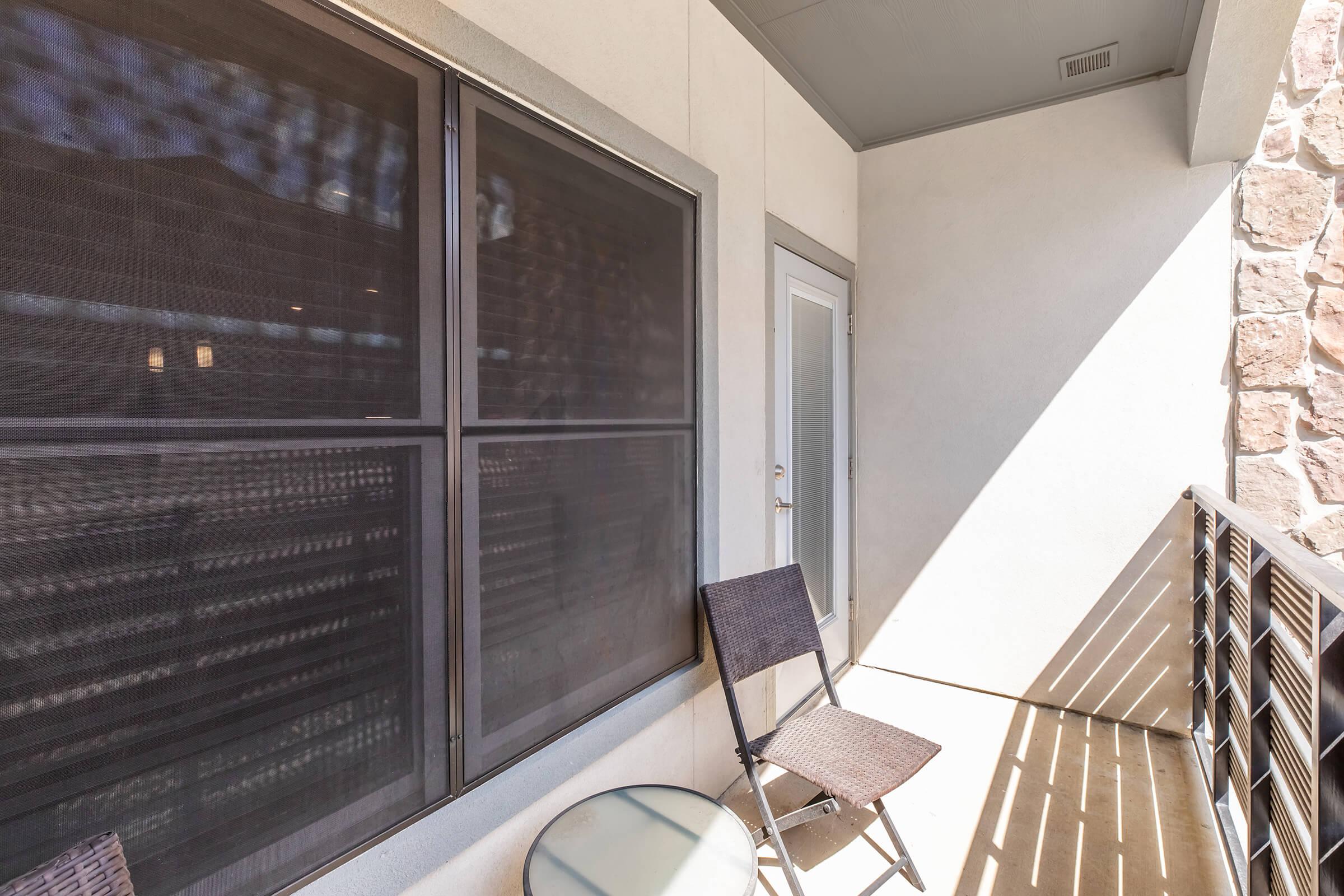 a chair sitting in front of a window