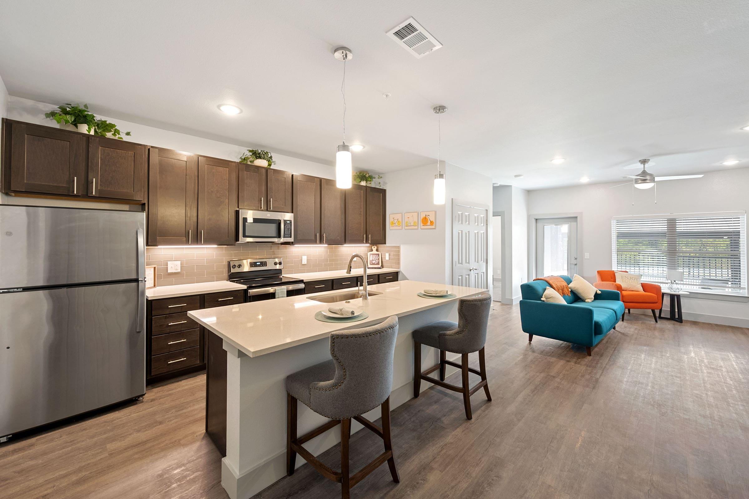 a kitchen with an island in the middle of a room