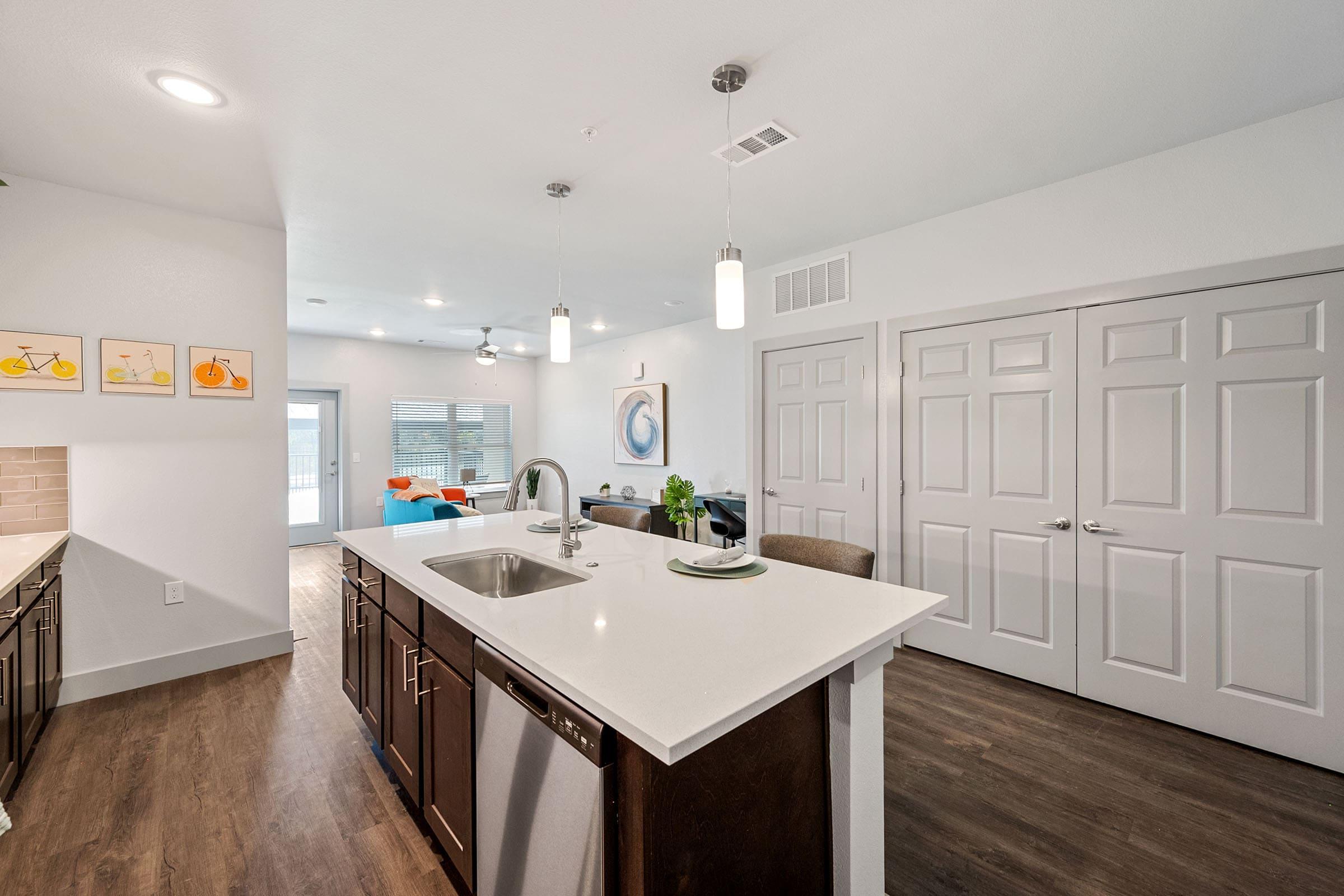 a kitchen with a sink and a refrigerator