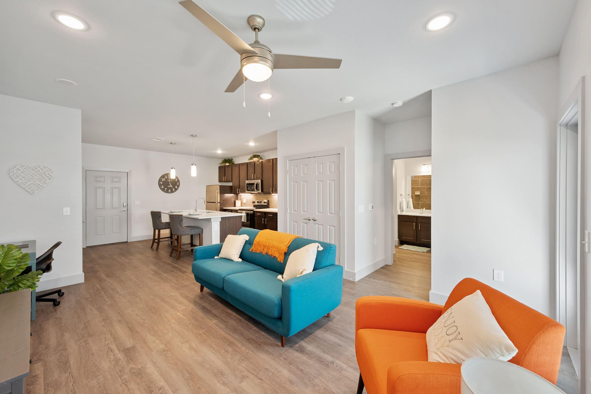 a living room filled with furniture and a flat screen tv