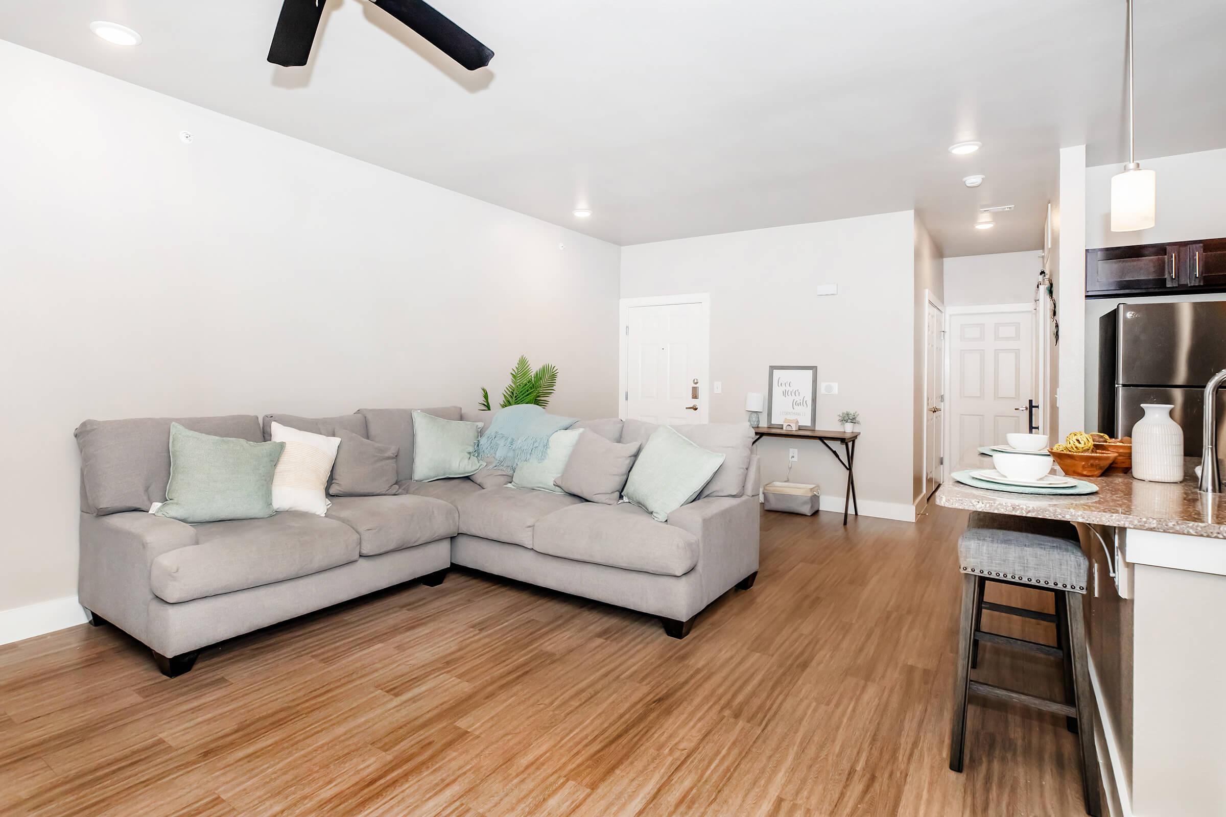 a room filled with furniture and a wood floor