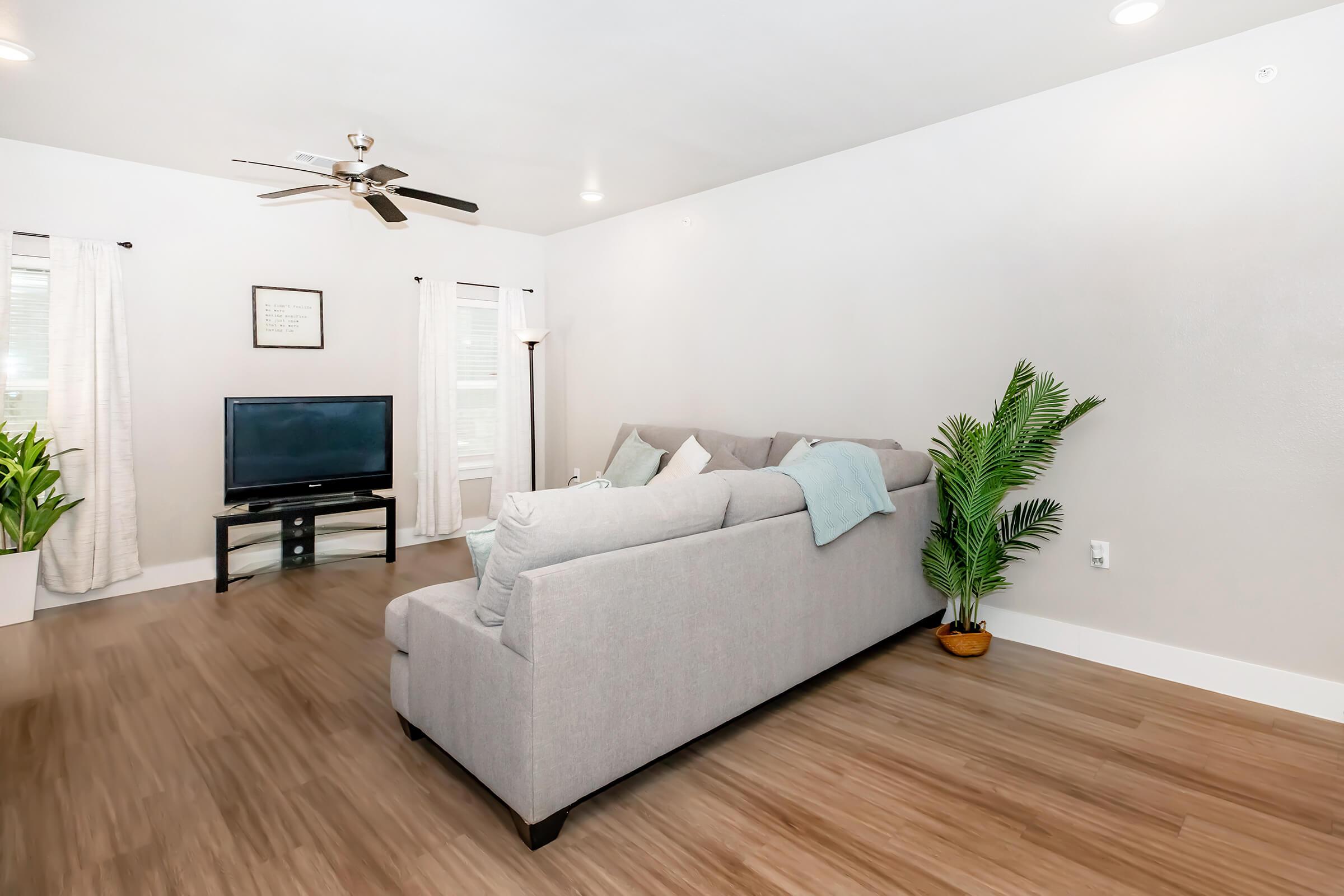 a living room with a hard wood floor