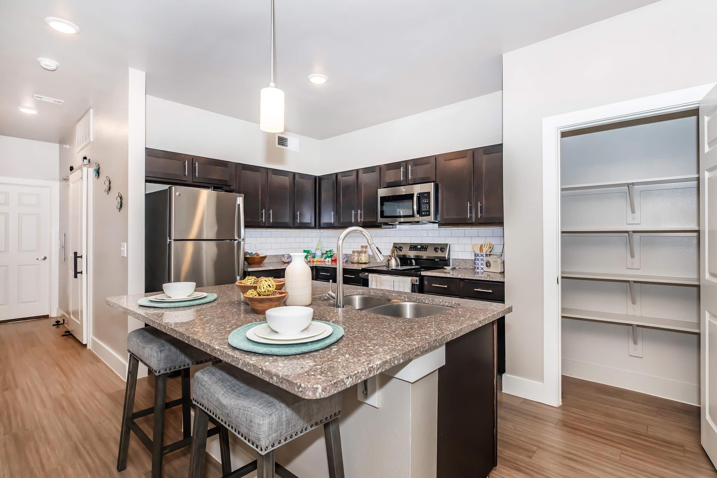 a kitchen with a sink and a window