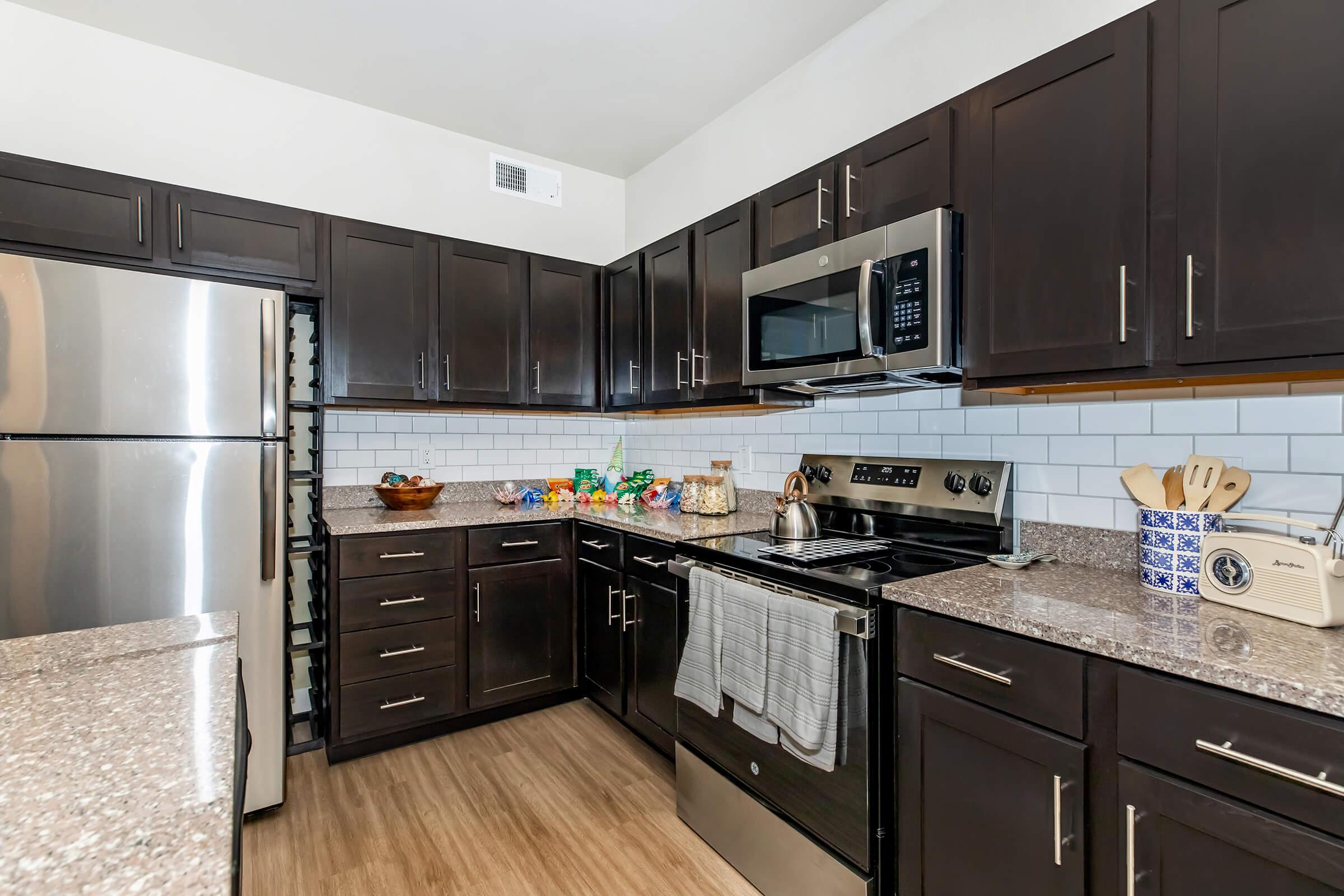 a modern kitchen with stainless steel appliances