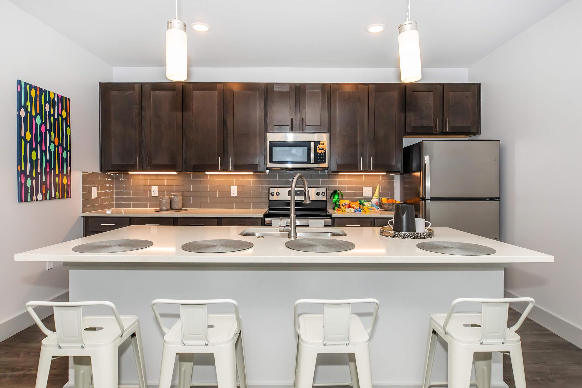 a kitchen with a table in a room