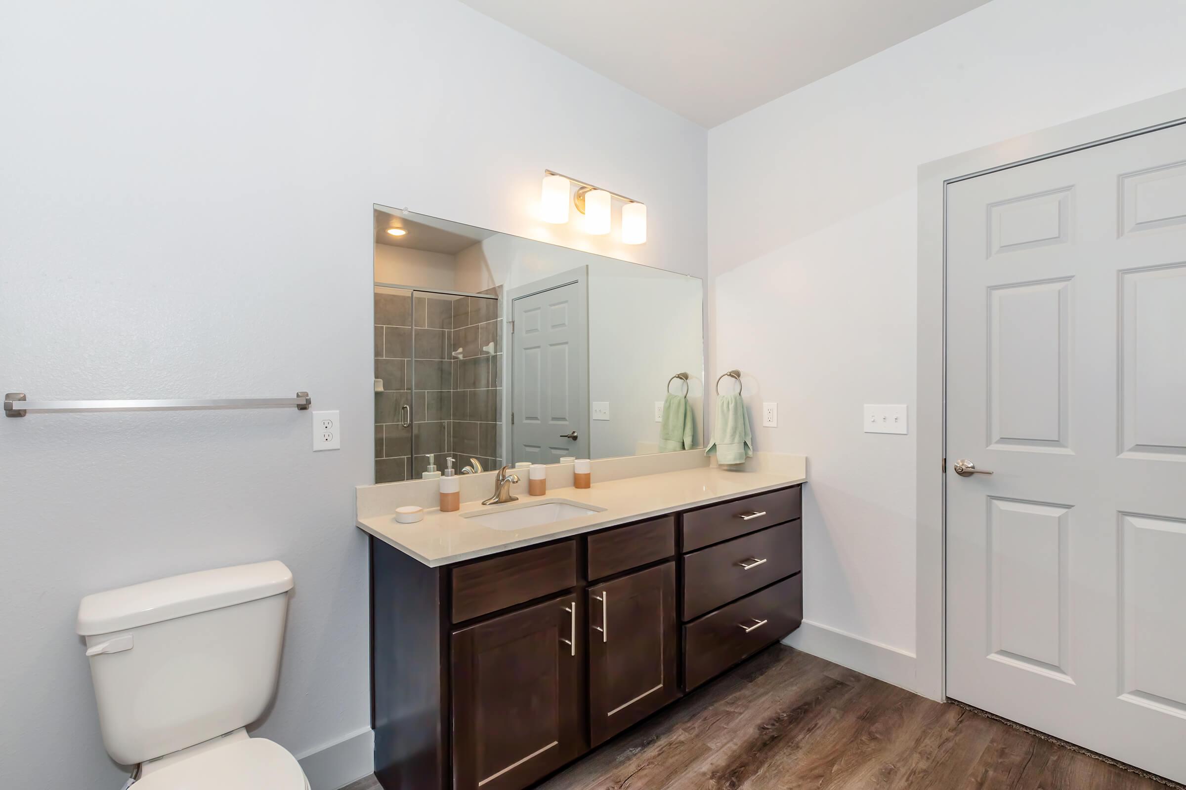 a kitchen with a sink and a mirror