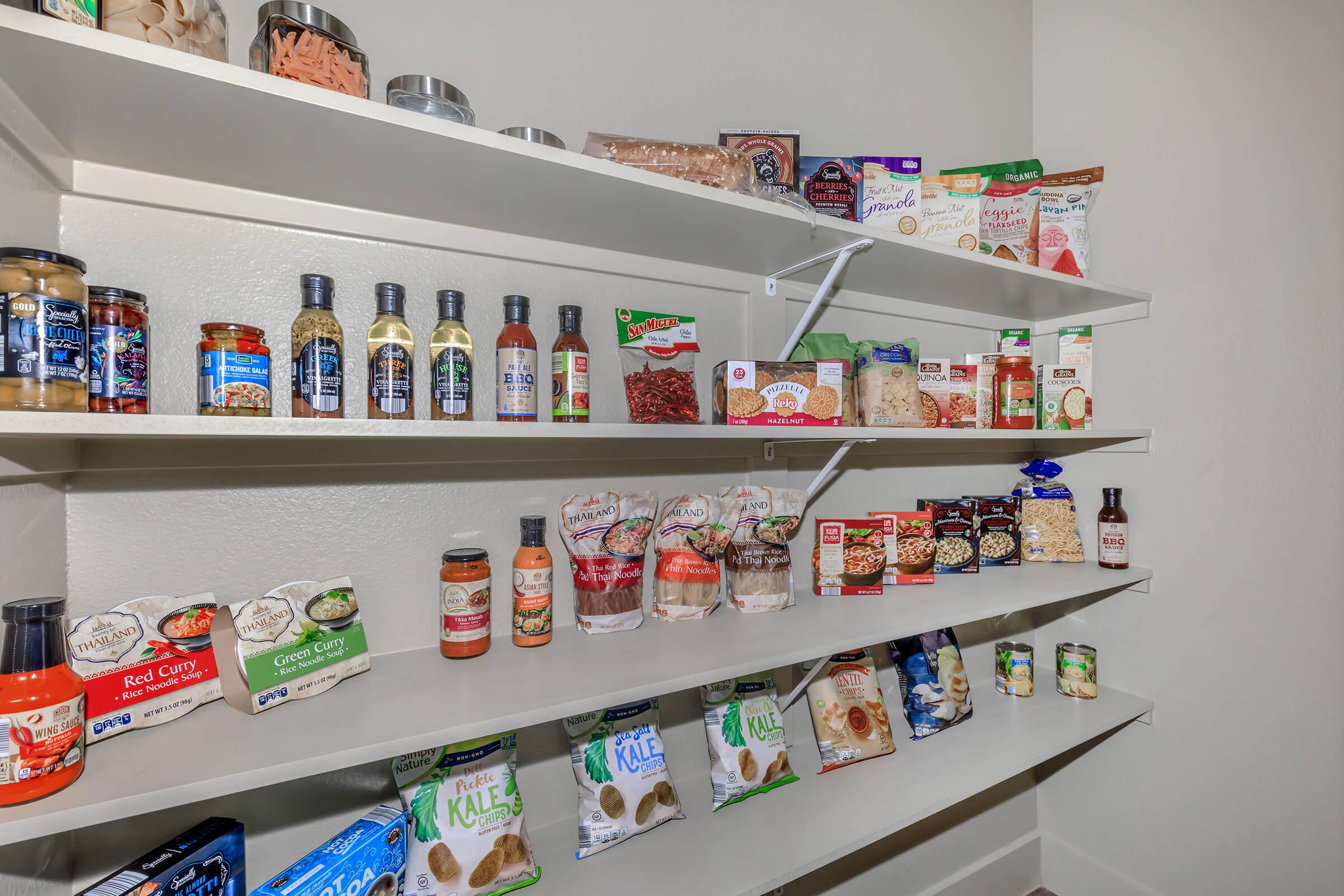 a bottle of items on top of a refrigerator