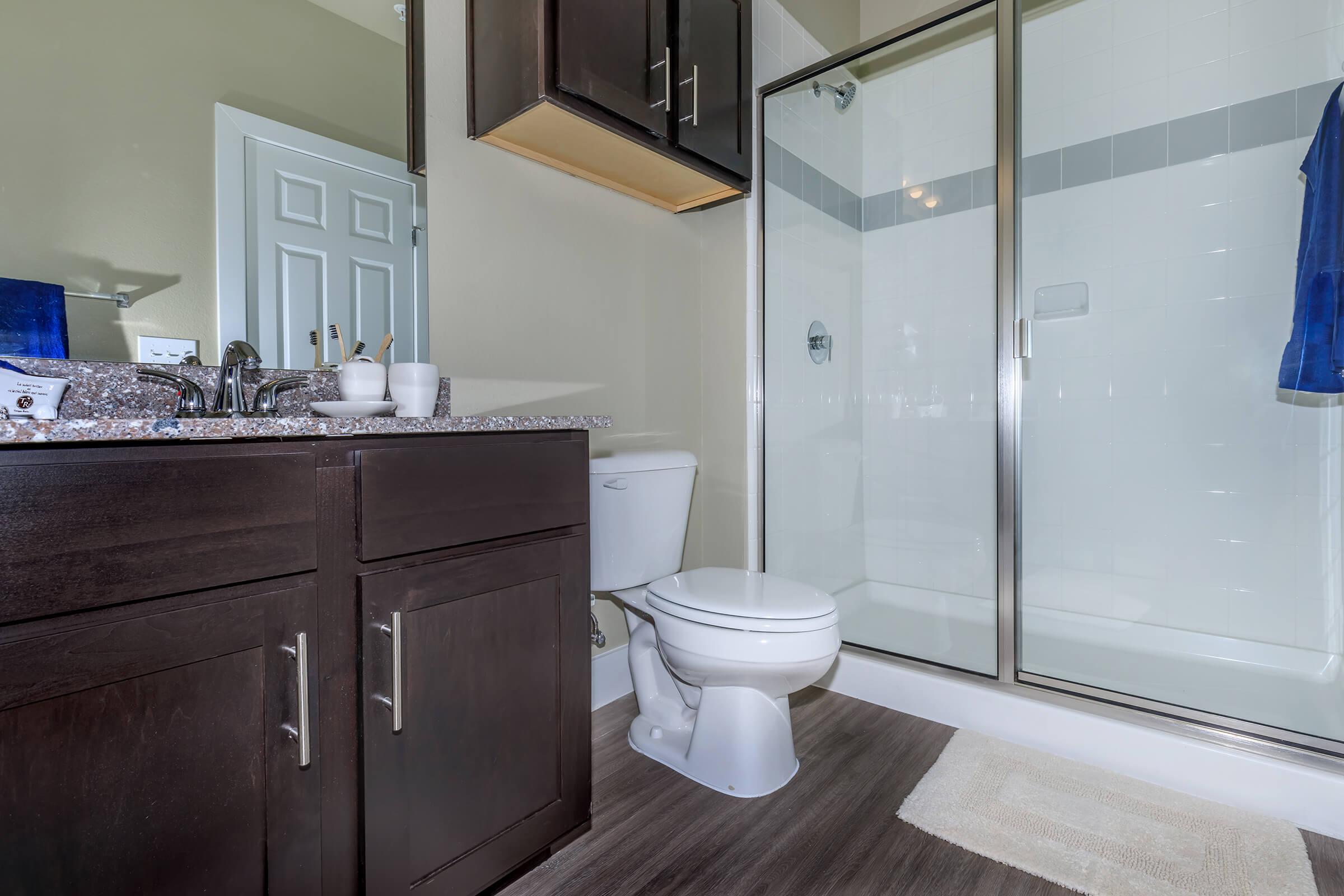 a white tub sitting next to a sink