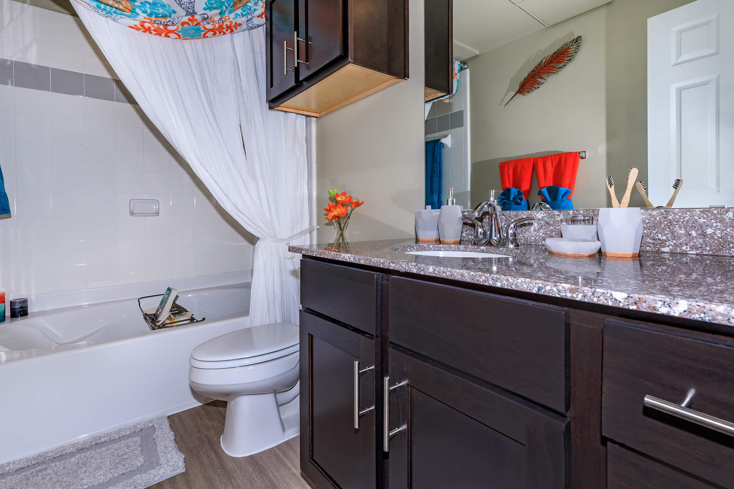 a kitchen with a sink and a mirror