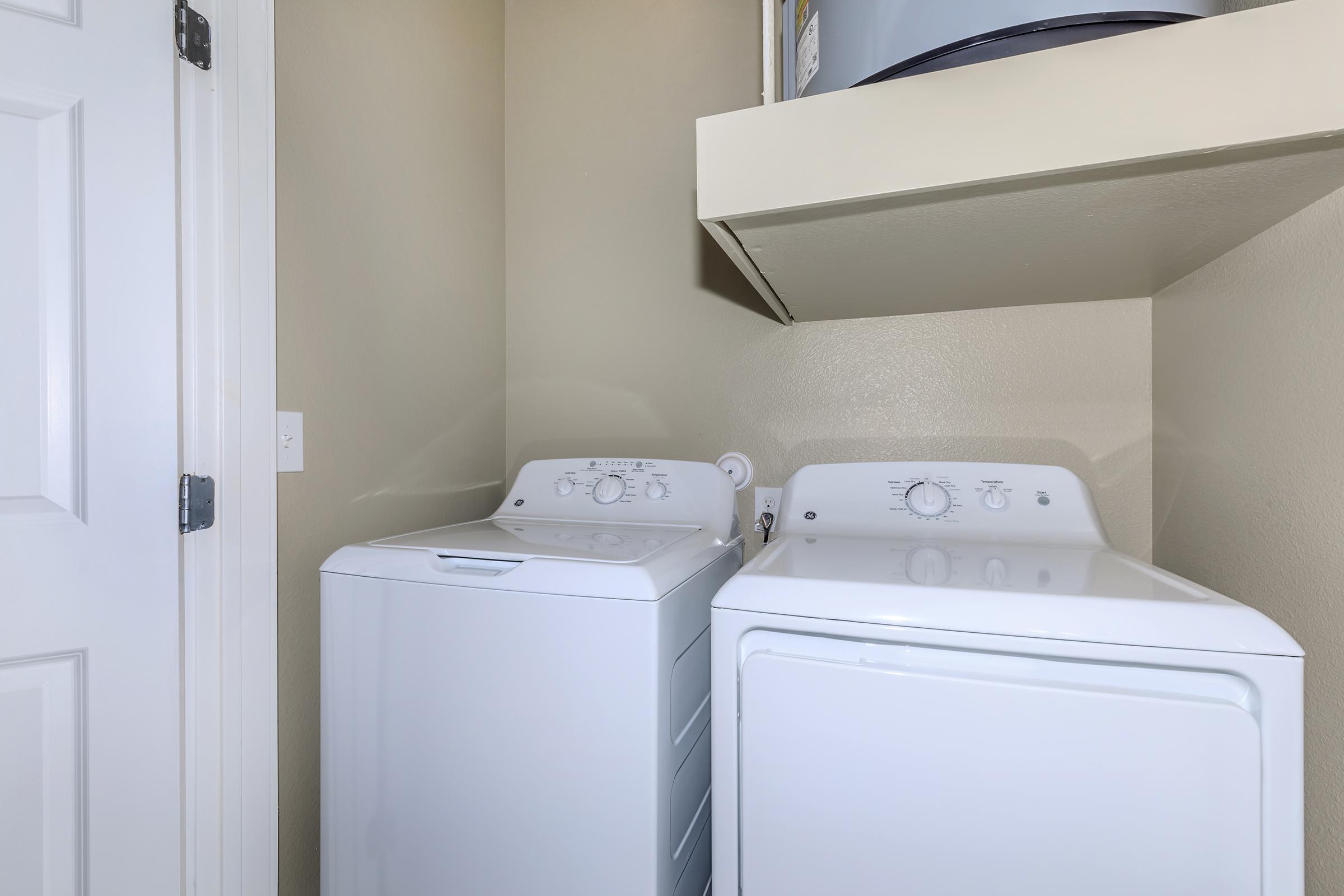 a white refrigerator freezer sitting next to a sink