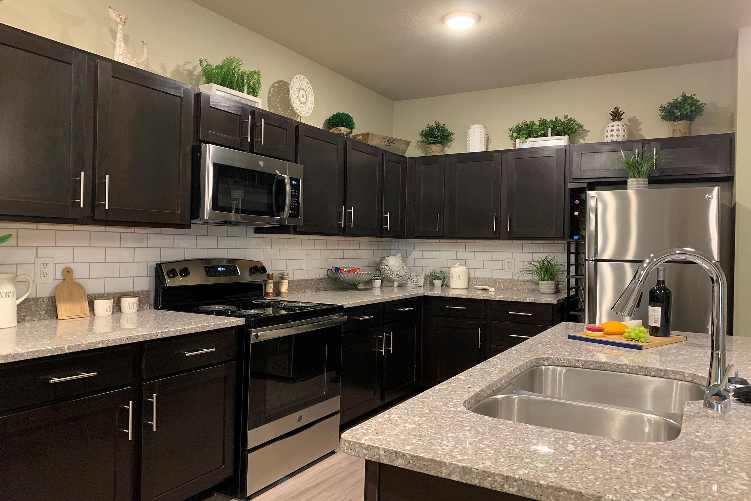 a modern kitchen with stainless steel appliances