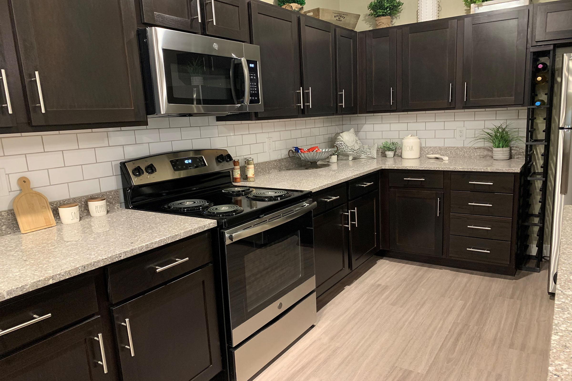 a modern kitchen with stainless steel appliances