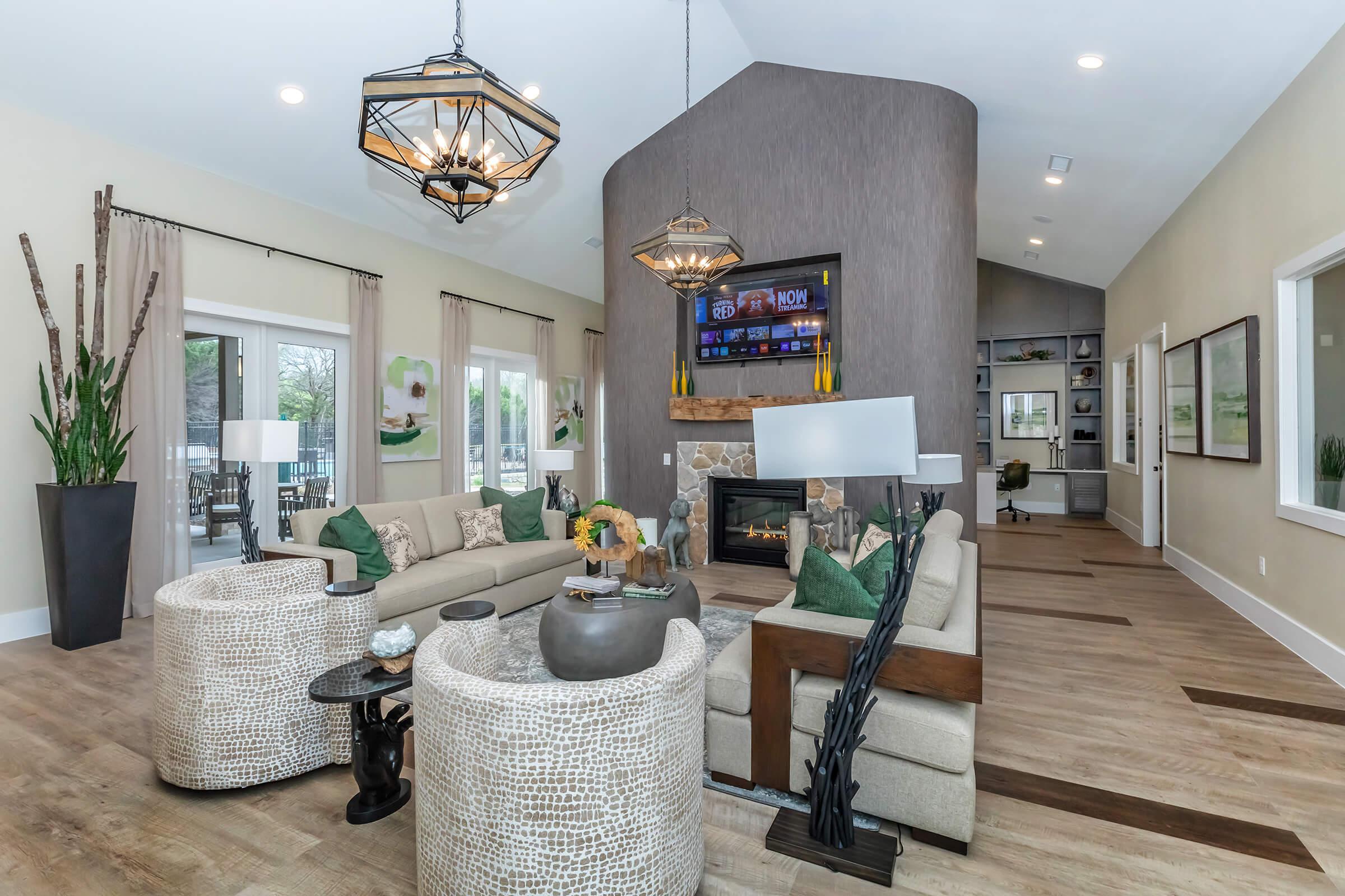 a living room filled with furniture and a fireplace