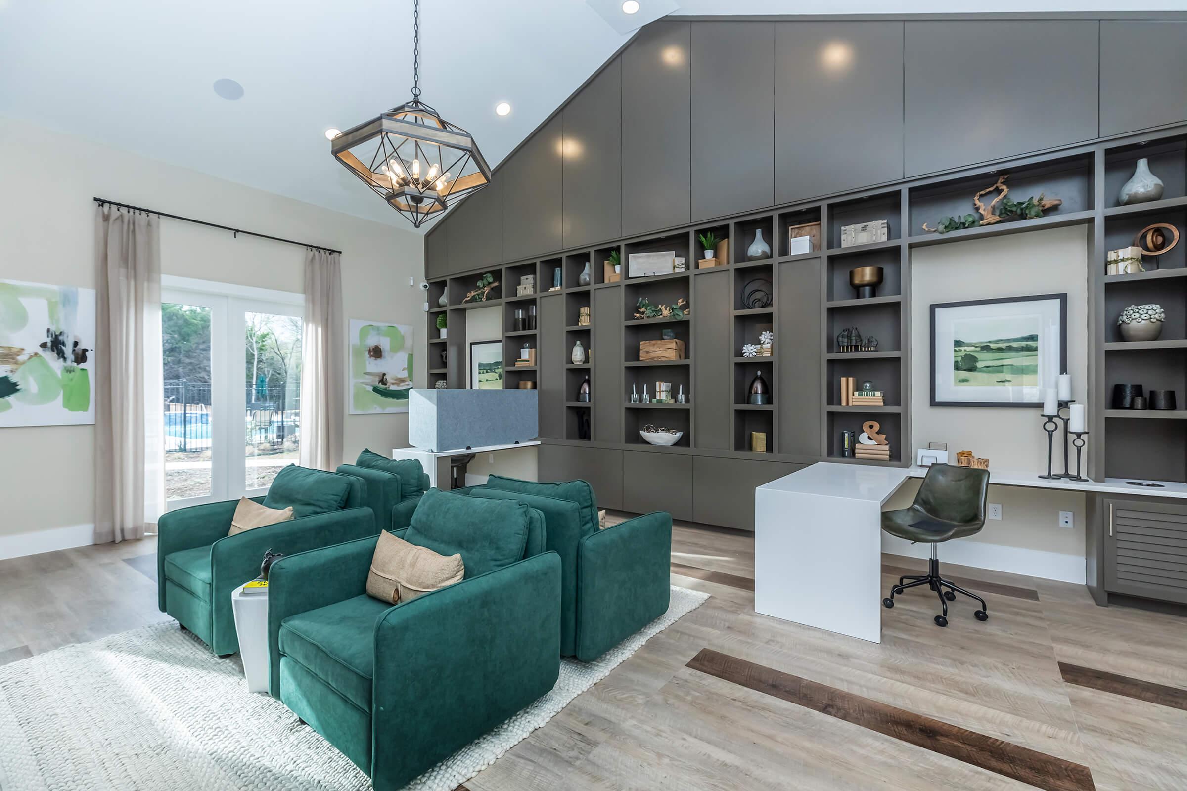 a living room filled with furniture and a large window