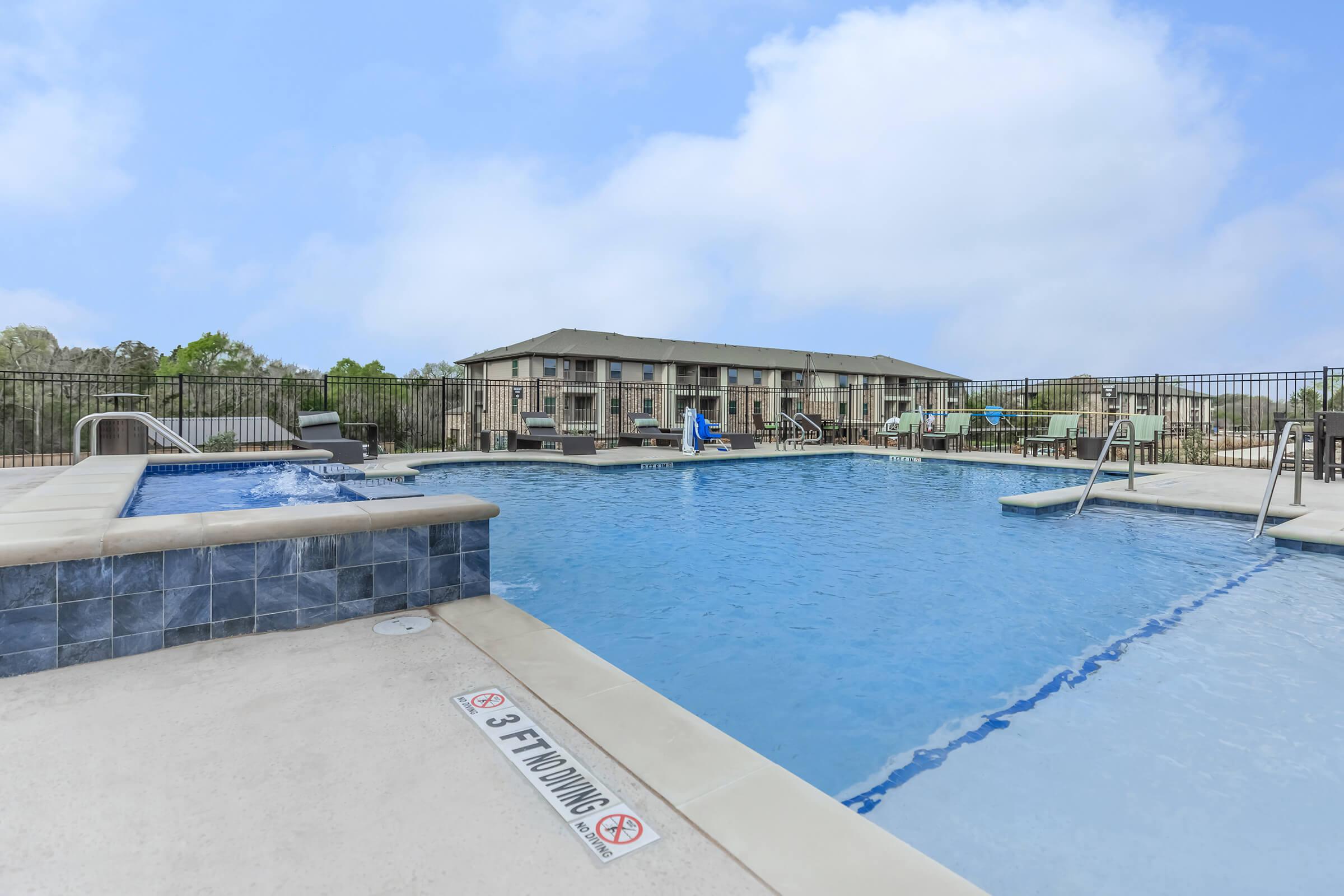 a pool next to a body of water