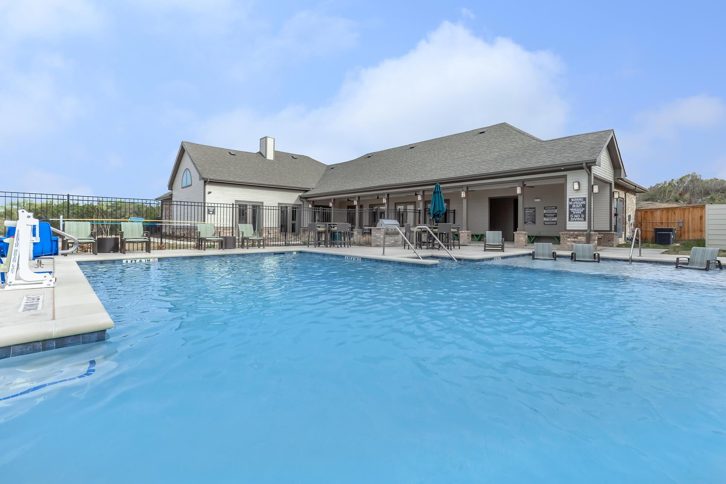 a house with a large pool of water