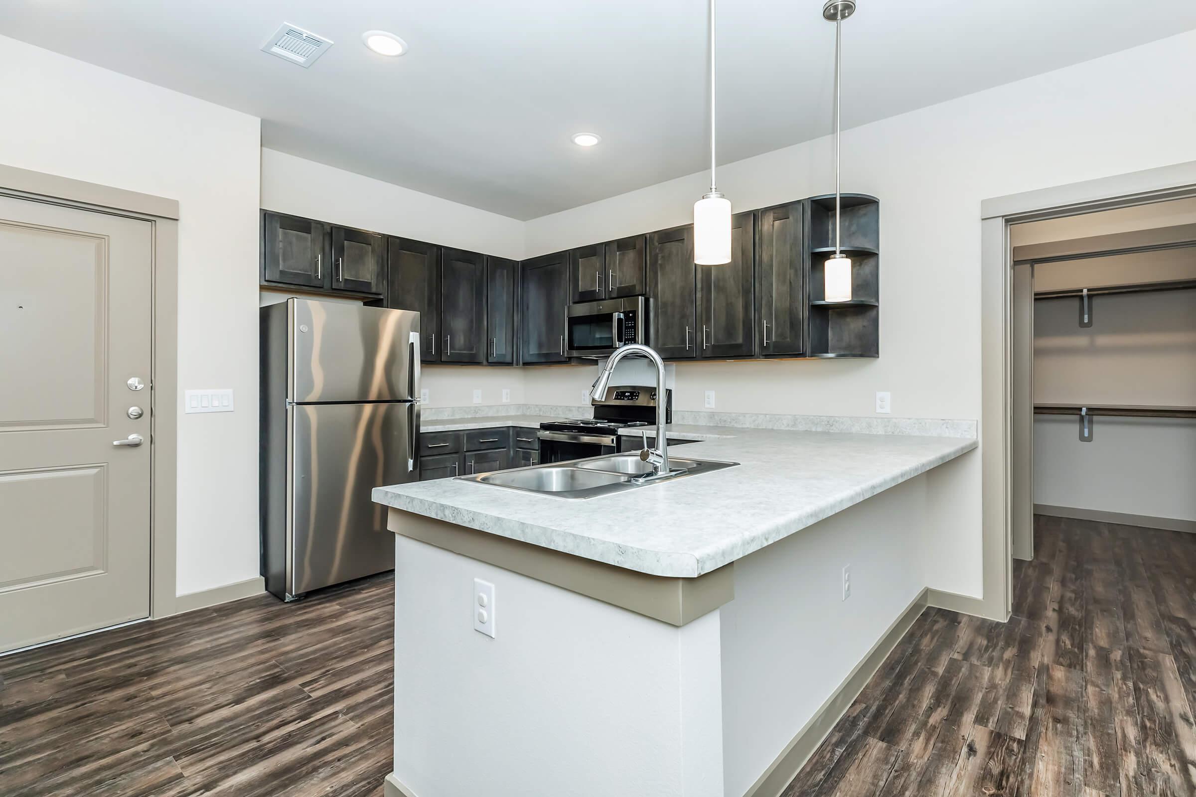 a modern kitchen with stainless steel appliances