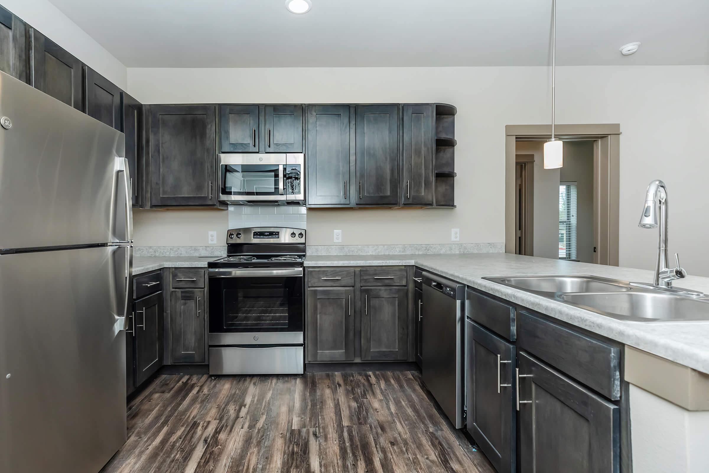 a large kitchen with stainless steel appliances