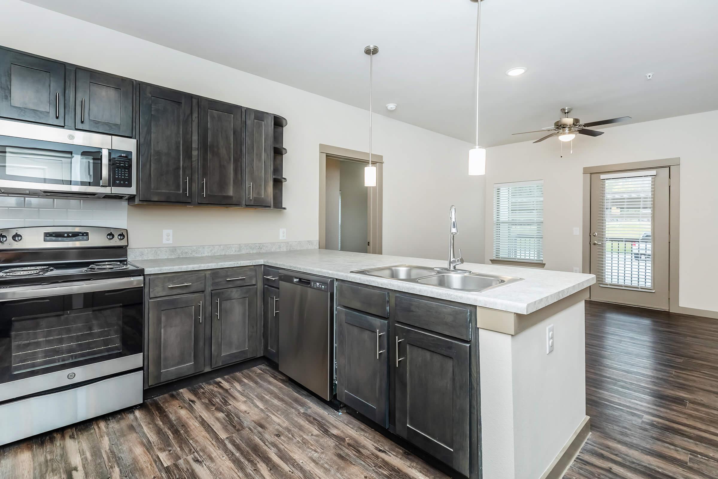 a large kitchen with stainless steel appliances